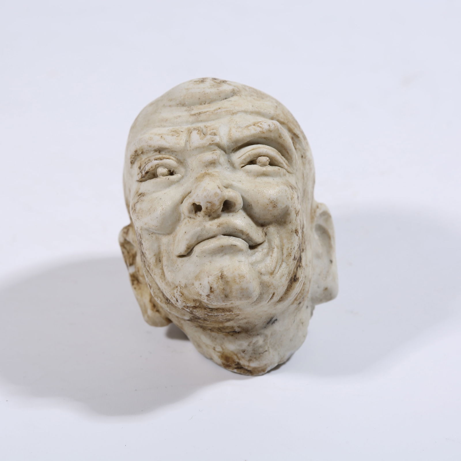 A REVERSE-PAINTED PORCELAIN LUOHAN HEAD (1 of 8)