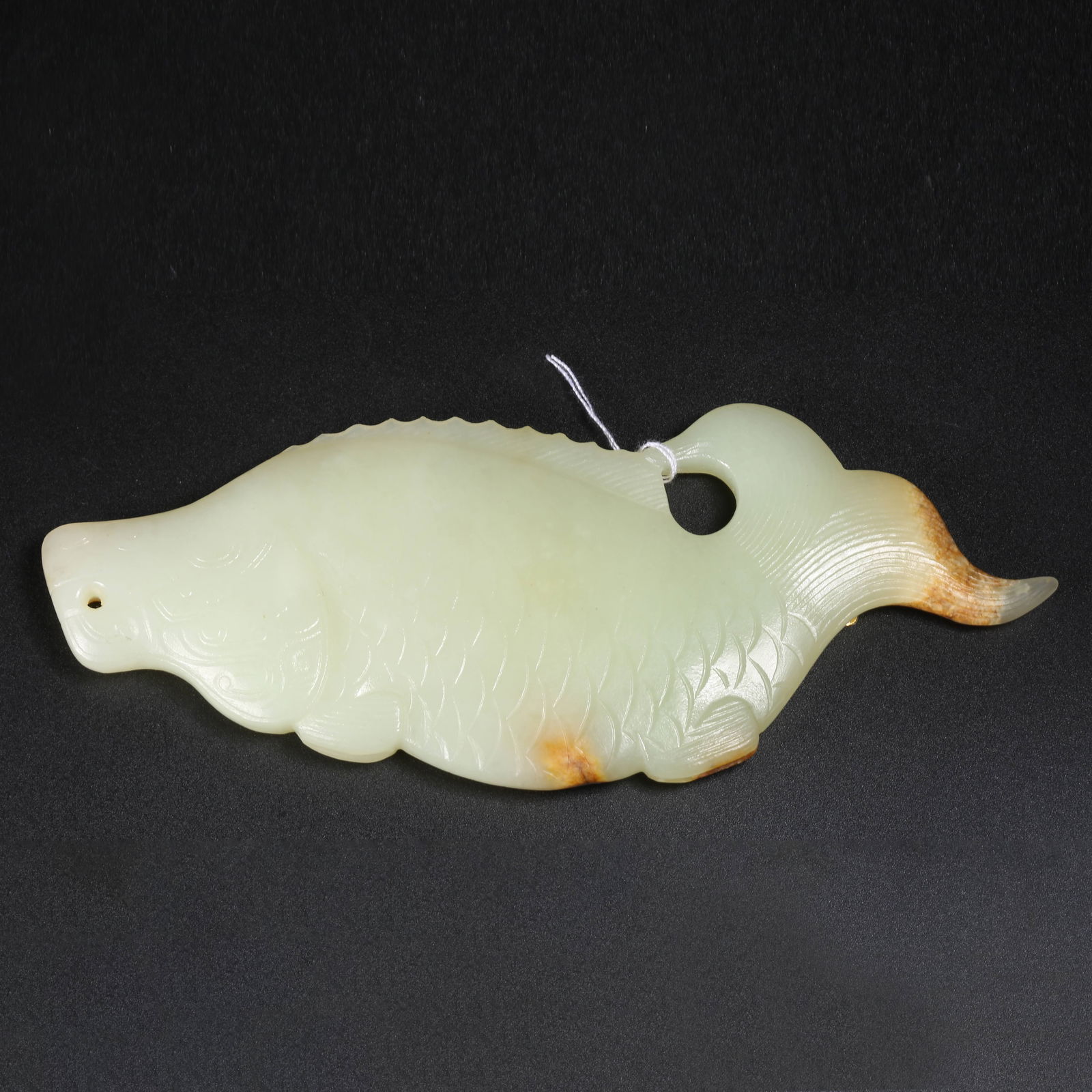 A HETIAN JADE DRAGON-AND-FISH PENDANT (1 of 9)