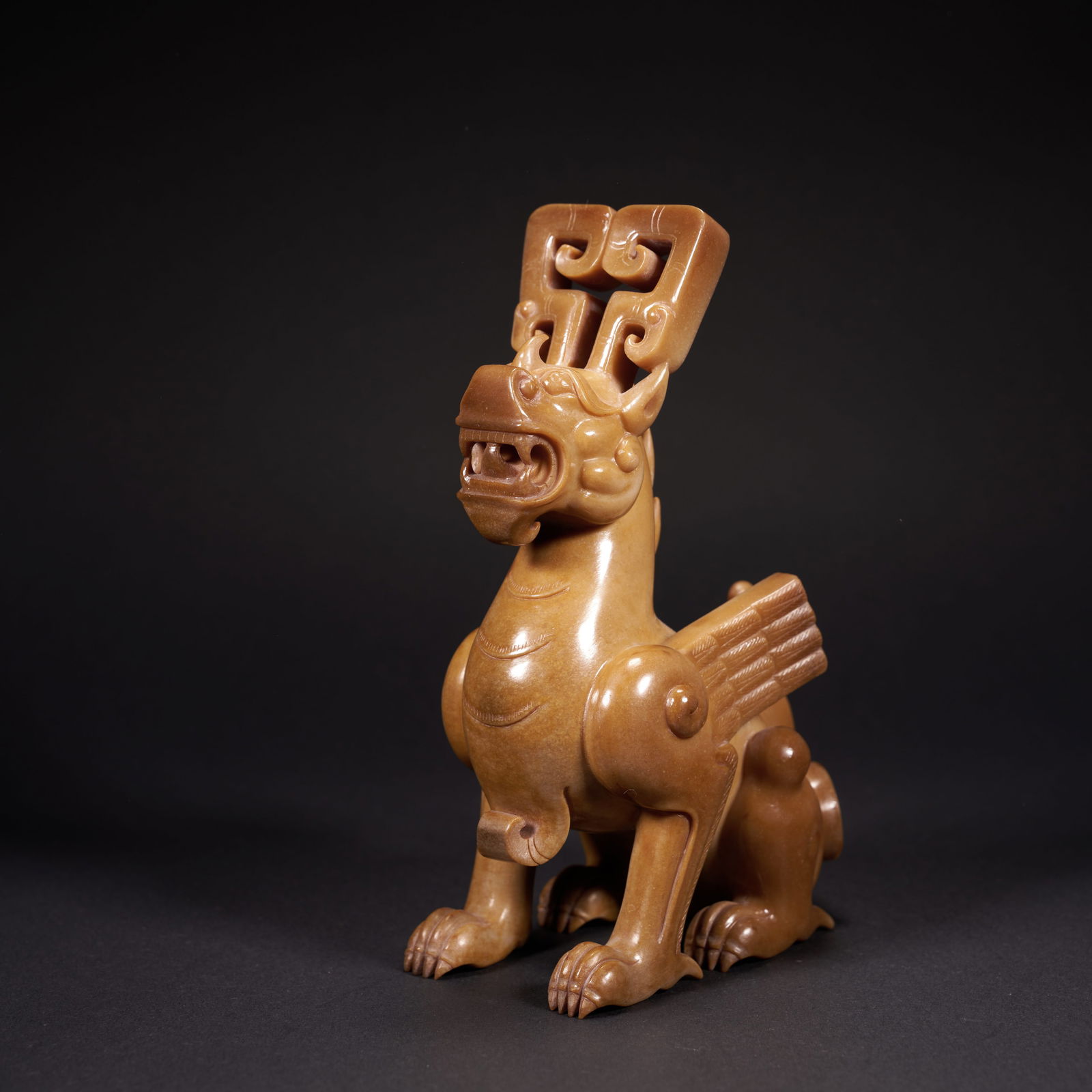 A HETIAN JADE AUSPICIOUS BEAST ORNAMENT, HAN DYNASTY (1 of 7)