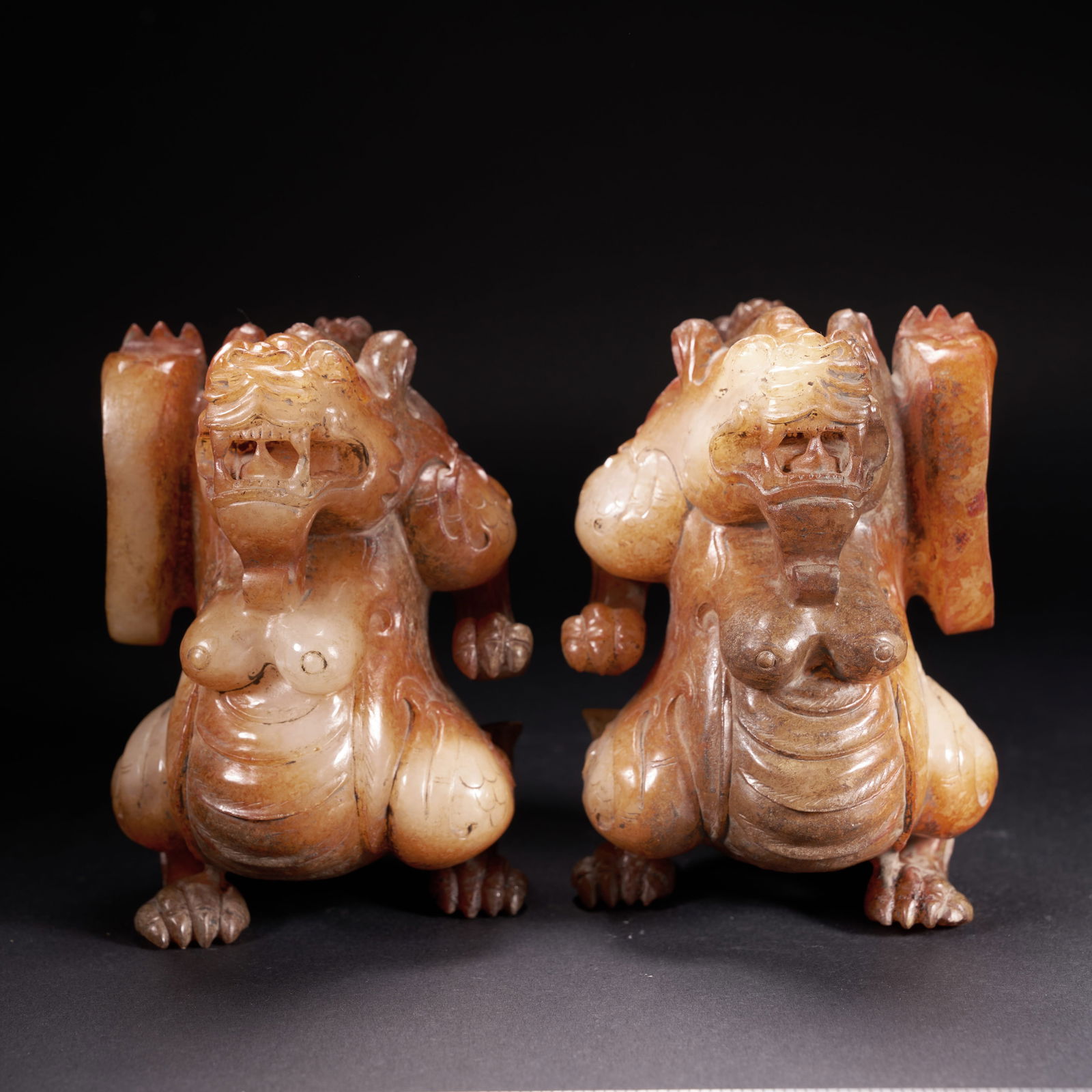 A HETIAN JADE STANDING AUSPICIOUS BEASTS, A GROUP, HAN DYNASTY (1 of 8)