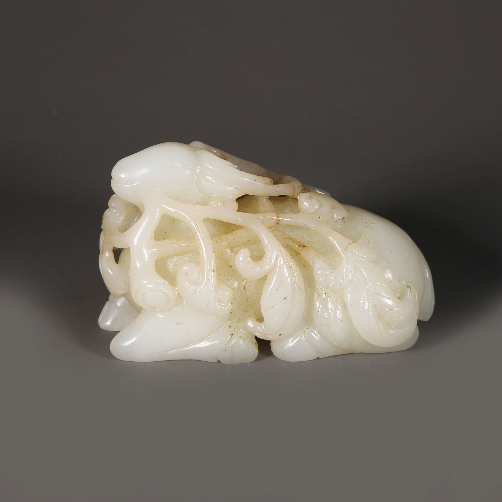 A HETIAN JADE SPIRITED DEER WITH LINGZHI ORNAMENT (1 of 6)