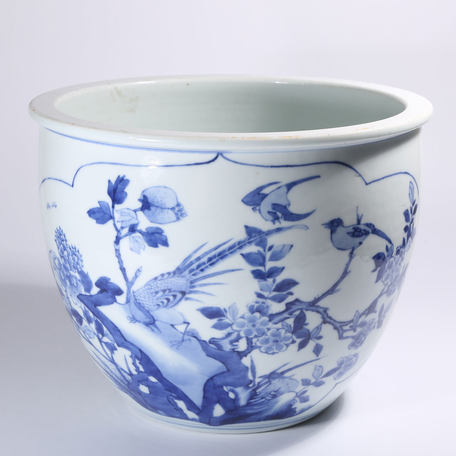 A BLUE-AND-WHITE JAR WITH FLORAL AND FOLIAGE MOTIFS (1 of 9)