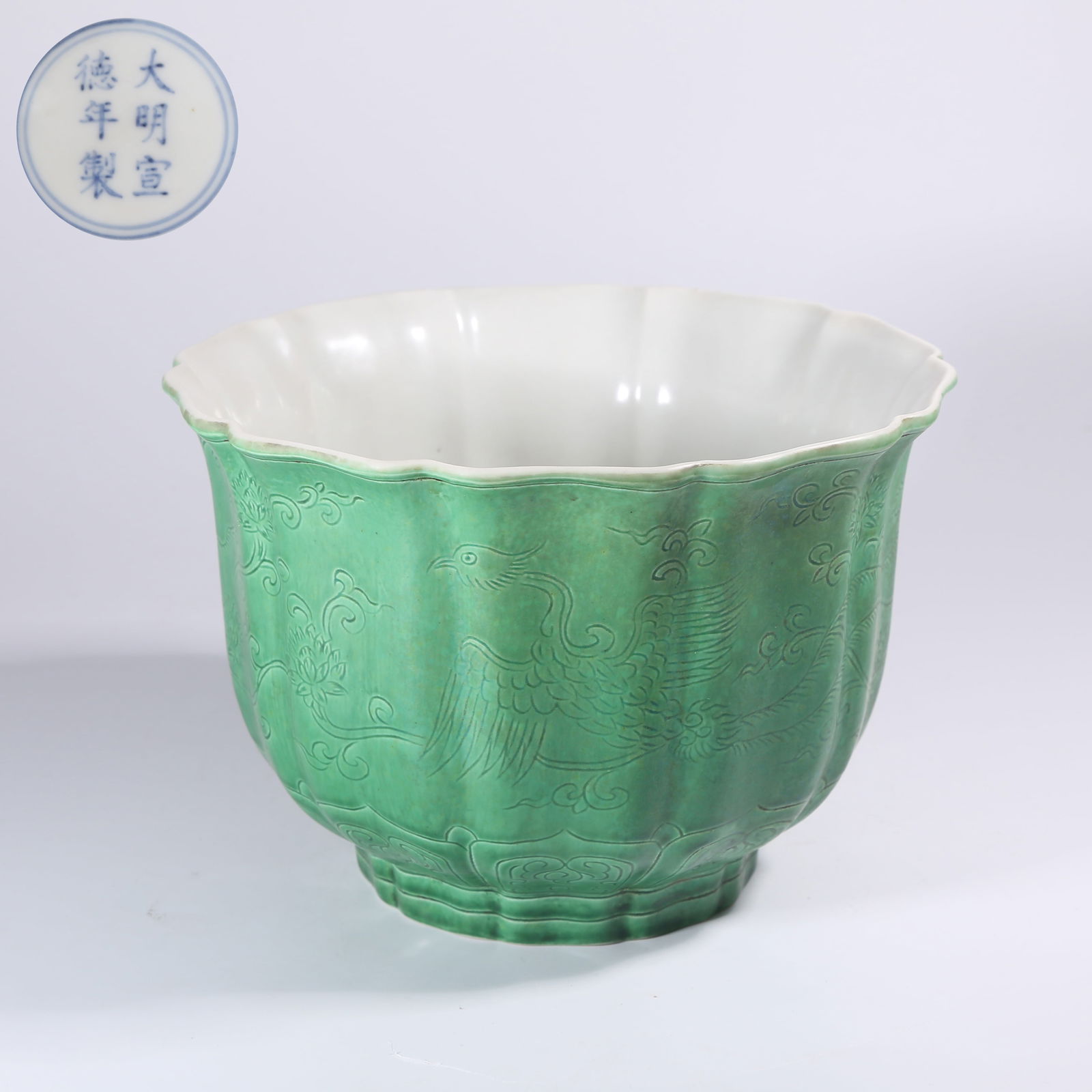 A GREEN-GLAZED FLARED-RIM BOWL WITH INCISED PIERCED PHOENIX MOTIFS (1 of 9)