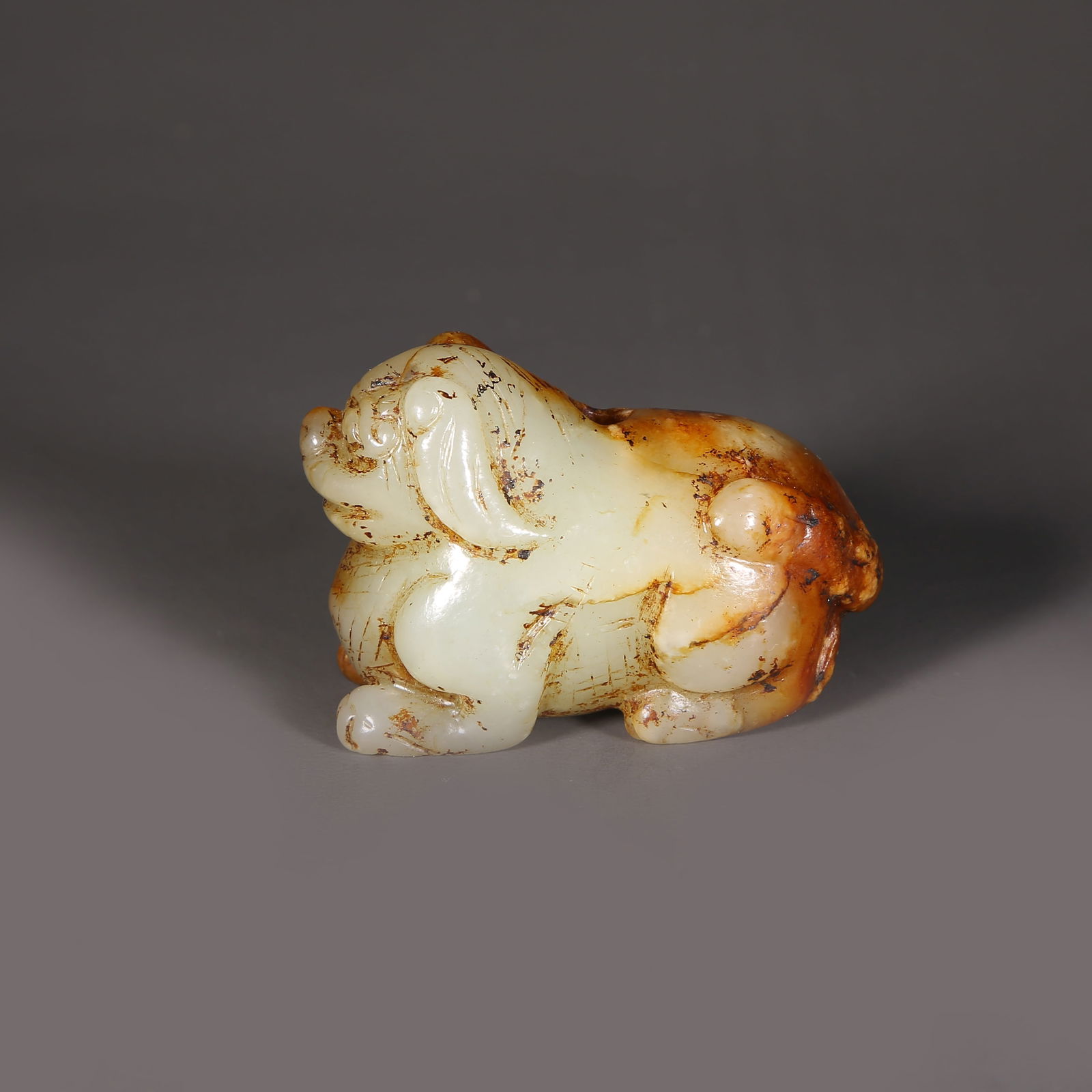 A ARCHAIC JADE MYTHICAL BEAST PENDANT (1 of 6)