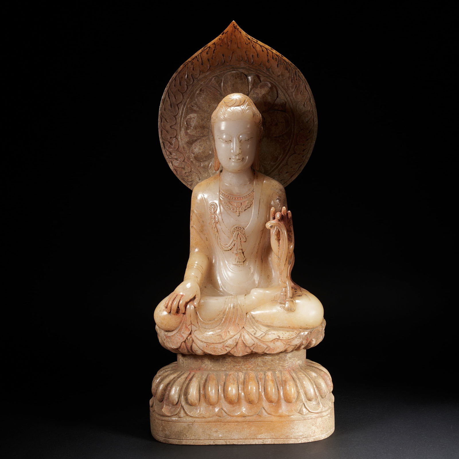 A HETIAN JADE SEATED FIGURE OF SHAKYAMUNI BUDDHA, TANG DYNASTY (1 of 10)