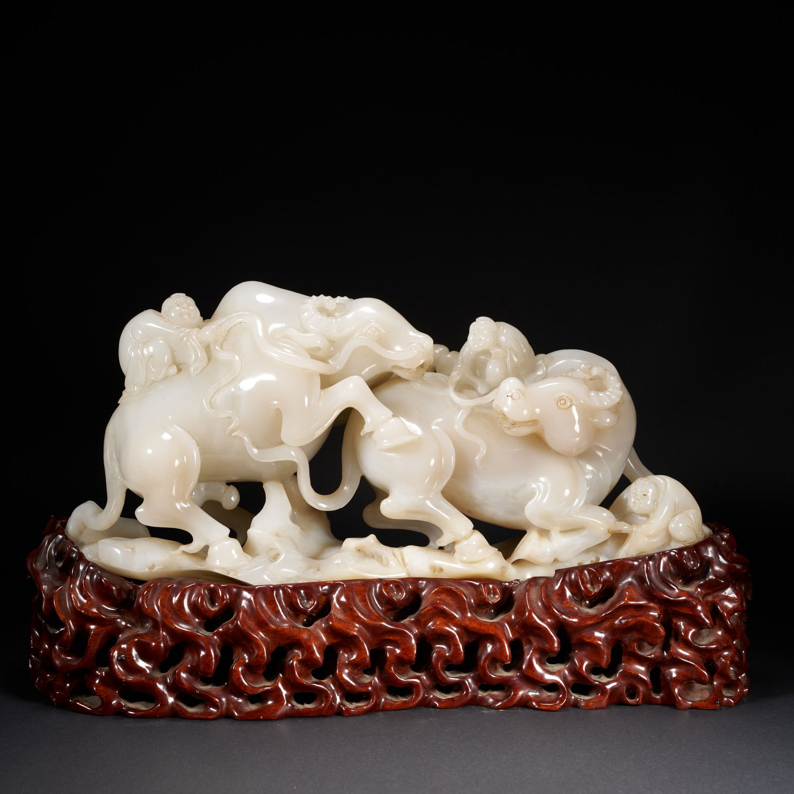 A HETIAN JADE "BOY PLAYING WITH AN OX" ORNAMENT, QING DYNASTY (1 of 10)