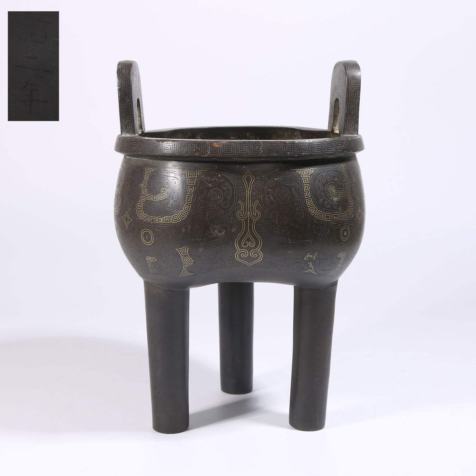 A BRONZE DING-STYLE CENSER WITH TAOTIE MASK DESIGN INLAID WITH GOLD AND SILVER (1 of 9)