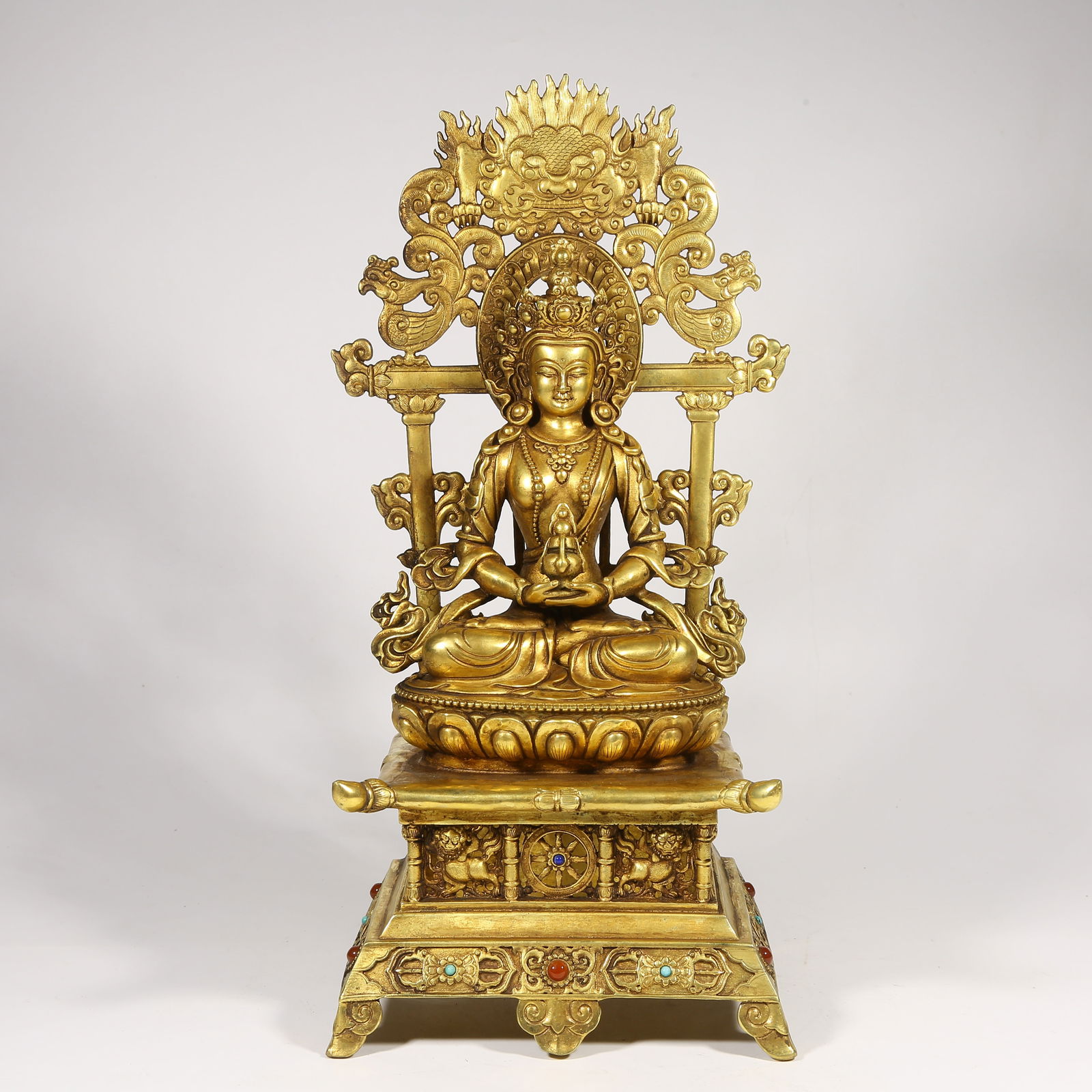 A GILDED BRONZE MEDICINE BUDDHA STATUE INLAID WITH GEMSTONES (1 of 8)