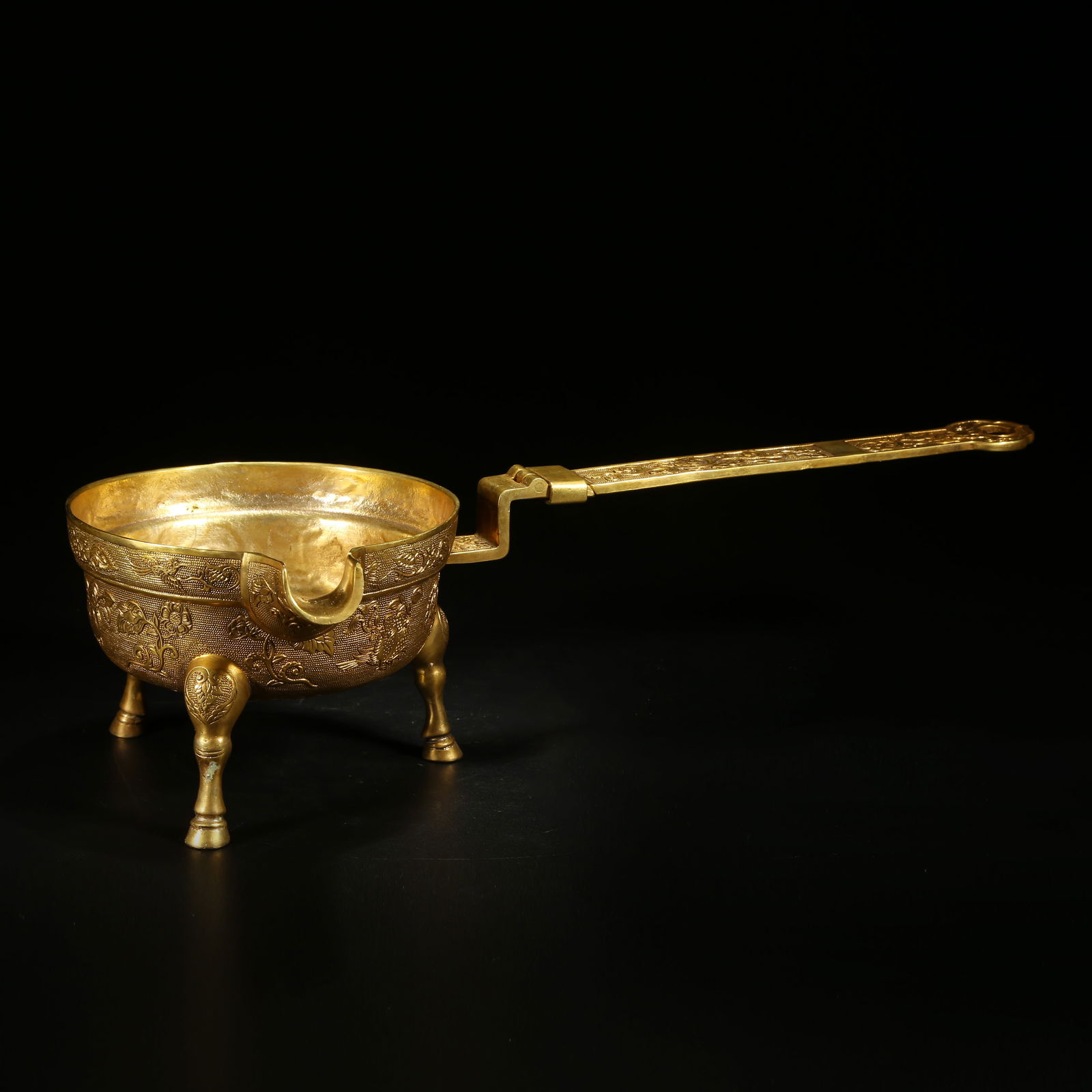 A GILDED BRONZE WINE SPOON WITH FLORAL AND BIRD PATTERN: Gilded Bronze Wine Spoon with Floral and Bird Pattern