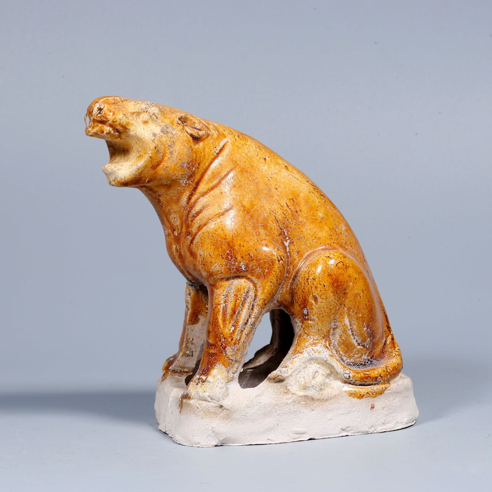 A MARBLED YELLOW-GLAZED TIGER-SHAPED ORNAMENT (1 of 9)