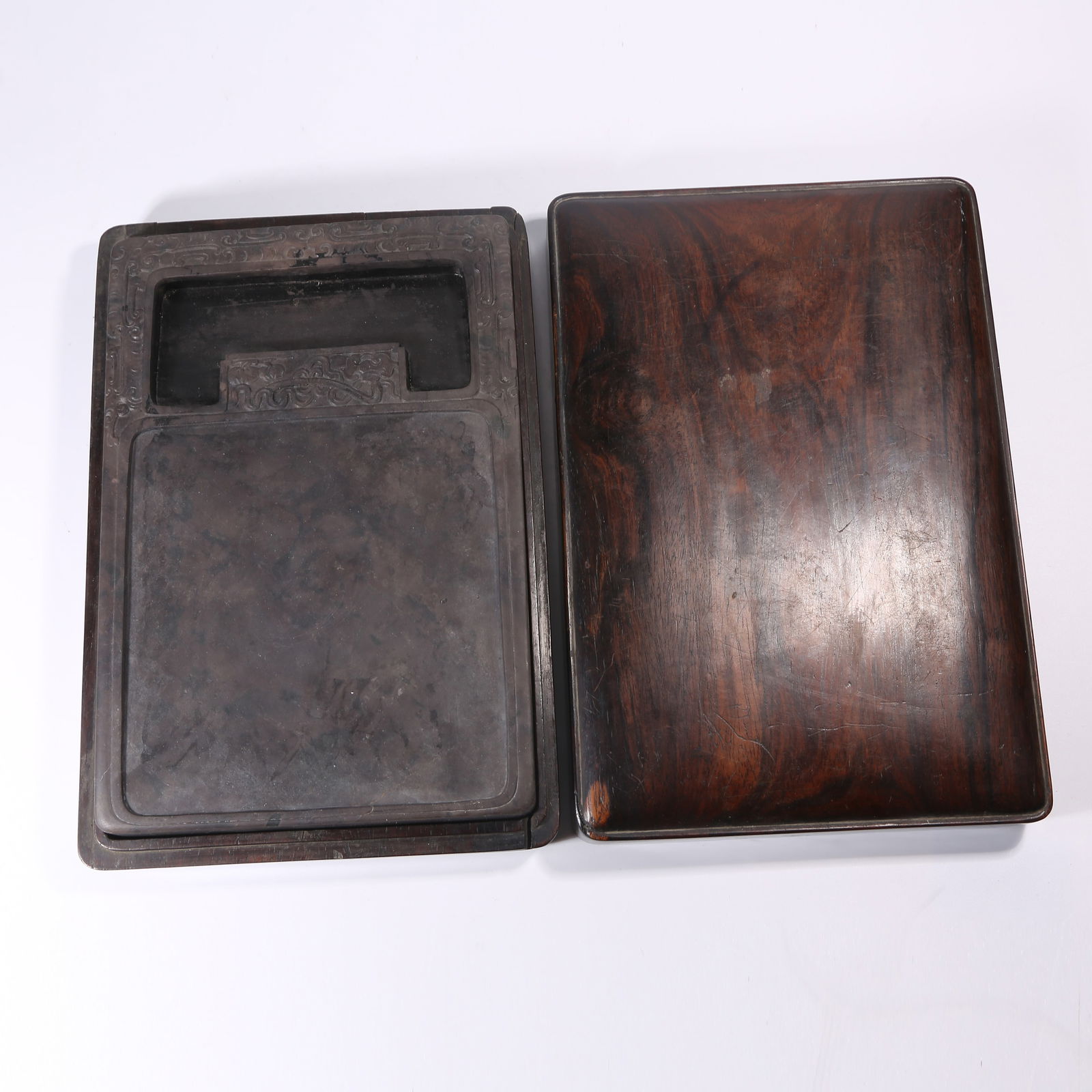 A DUANSHI "SHISHI RUYI" INKSTONE: Duanshi "Shishi Ruyi" inkstone