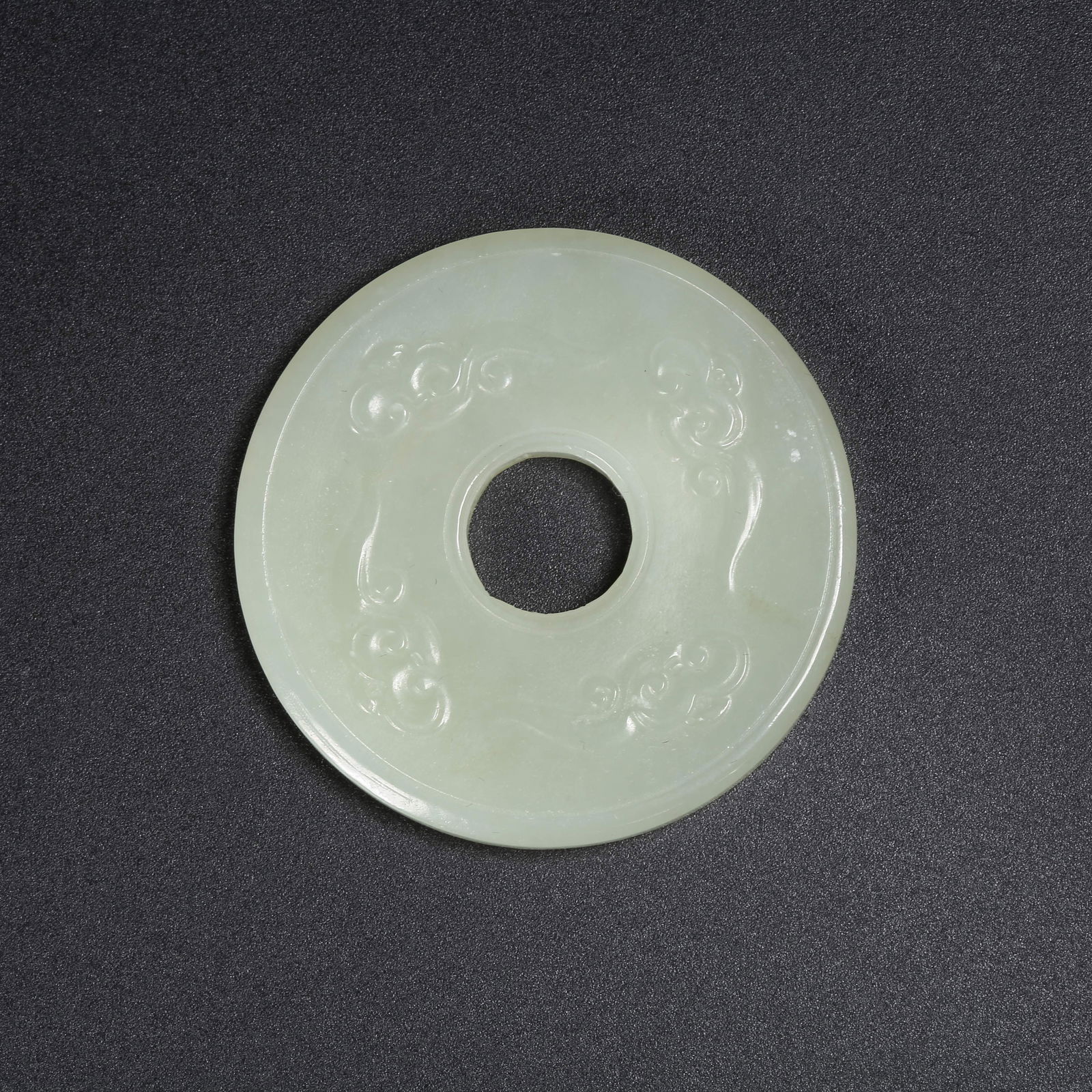 A HETIAN JADE RING WITH AUSPICIOUS CLOUD PATTERN (1 of 9)