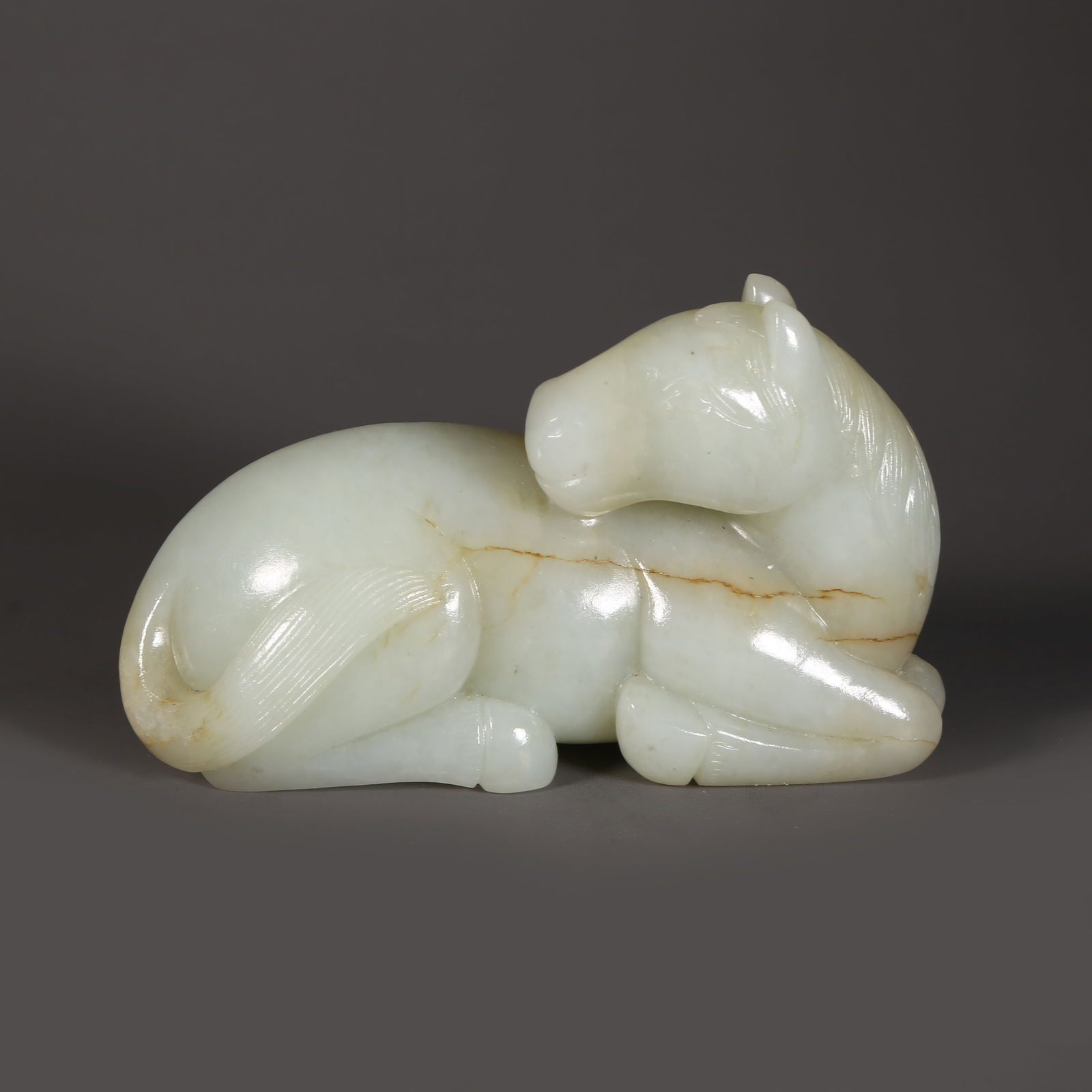 A HETIAN JADE RECUMBENT HORSE ORNAMENT (1 of 8)