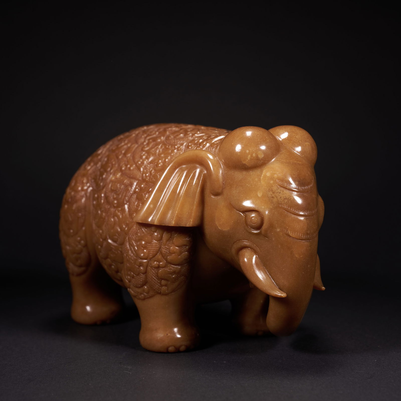 A HETIAN JADE "TAIPING YOUXIANG" (PEACE AND AUSPICIOUS ELEPHANT) ORNAMENT, HAN DYNASTY (1 of 7)