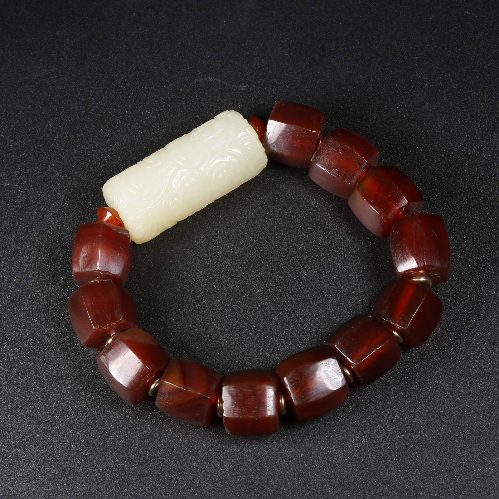 A HETIAN JADE LEZI HAND-STRUNG BRACELET (1 of 7)