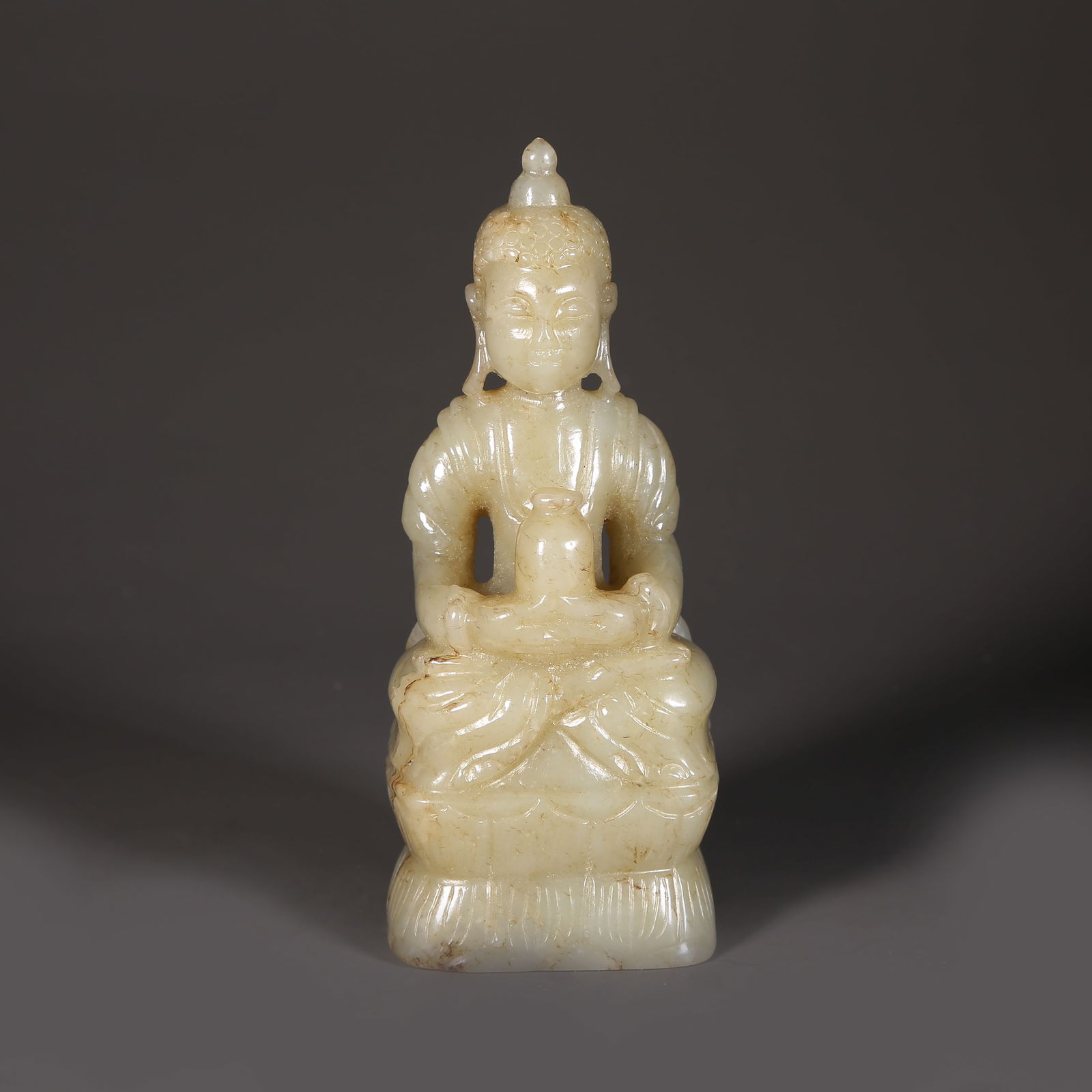 A HETIAN JADE SEATED SHAKYAMUNI STATUE (1 of 10)