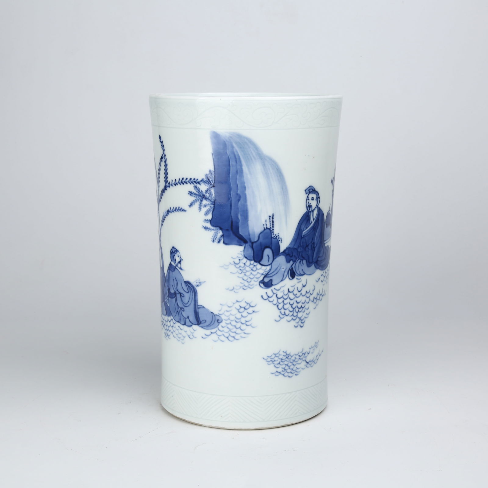 A BLUE-AND-WHITE SCHOLAR FIGURE BRUSH POT (1 of 9)