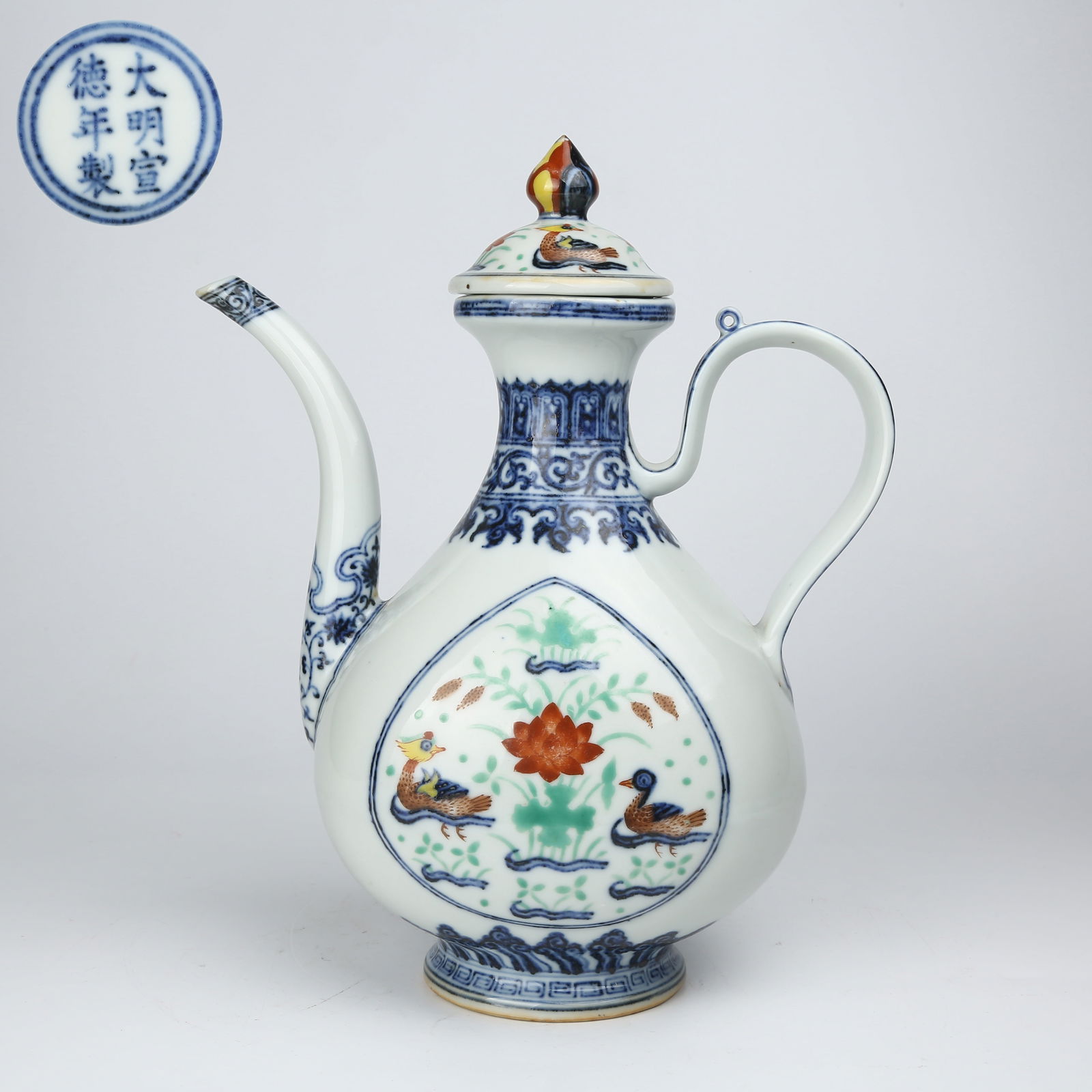 A BLUE-AND-WHITE WUCAI LOTUS POND WITH MANDARIN DUCKS EWER (1 of 9)