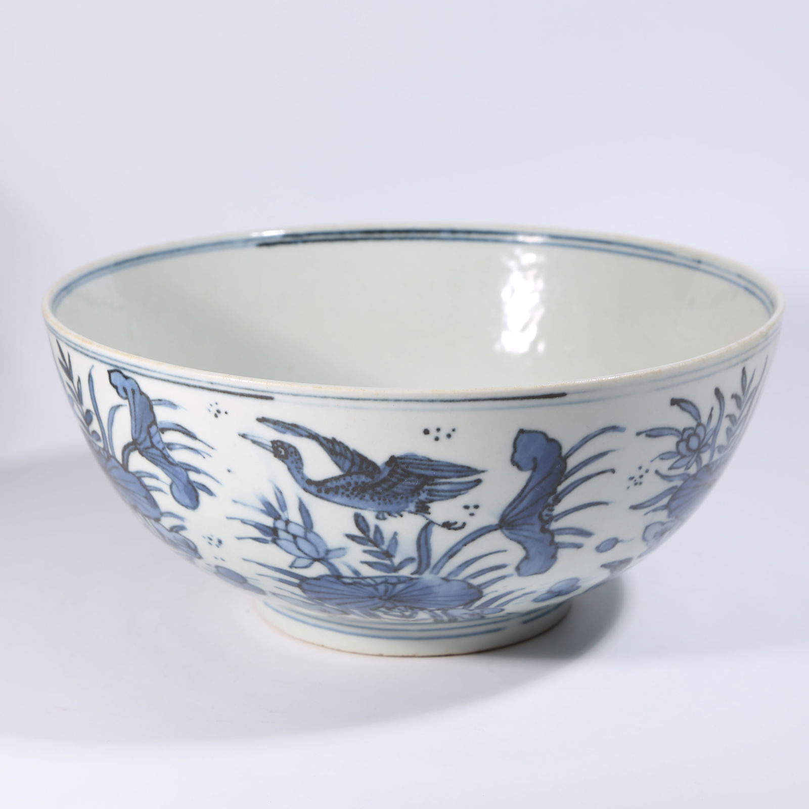 A BLUE-AND-WHITE LARGE BOWL WITH LOTUS POND AND MANDARIN DUCK DESIGN: Blue-and-white large bowl with lotus pond and mandarin duck design