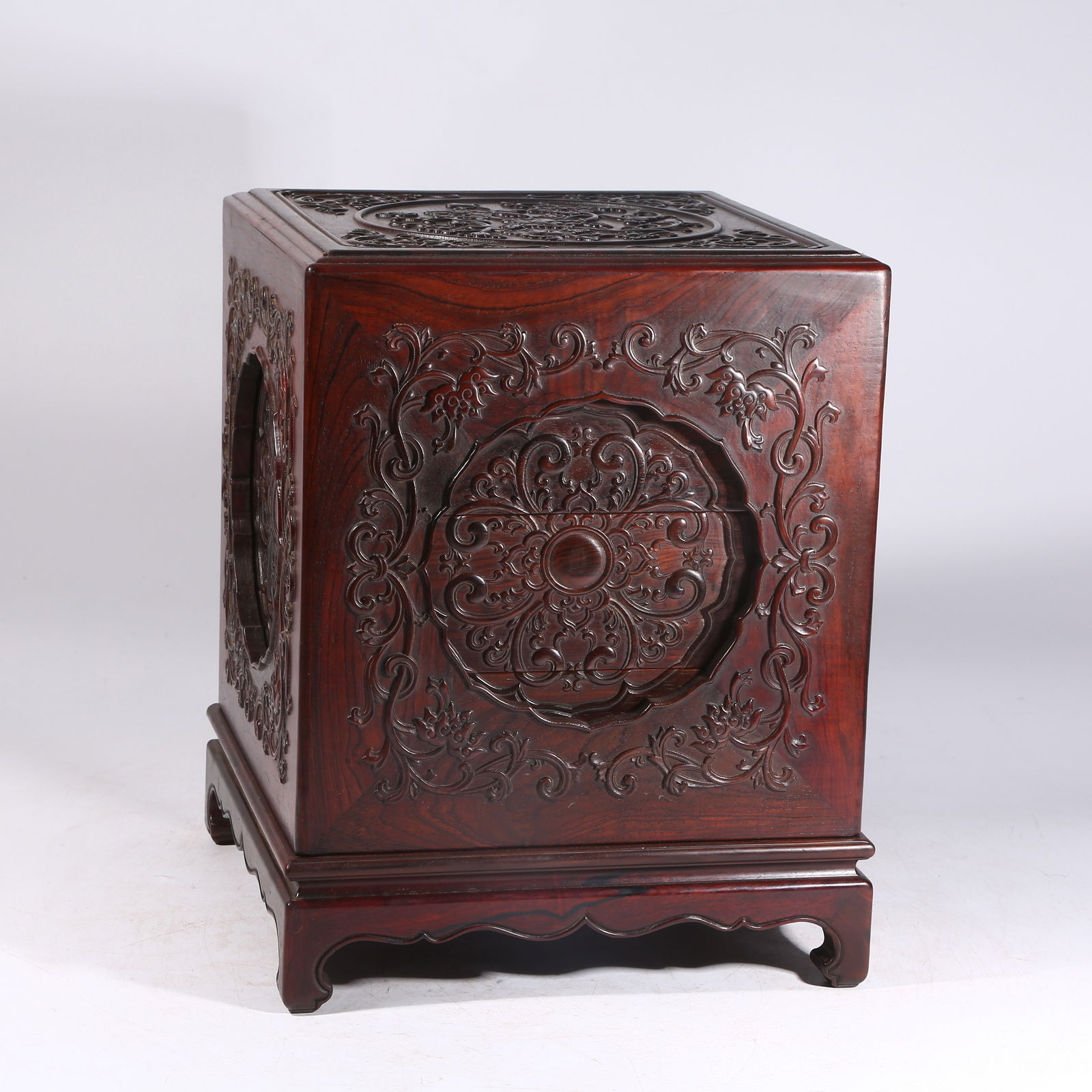 A HUANGHUALI WOOD COVERED BOX WITH INTERTWINED FLORAL PATTERN: Huanghuali Wood Covered Box with Intertwined Floral Pattern
