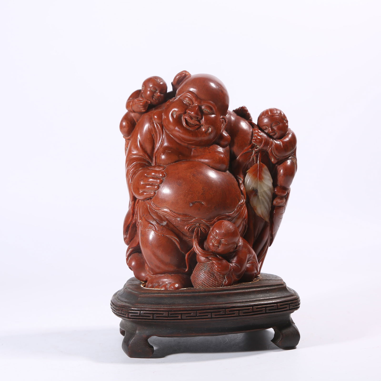A SHOUSHAN STONE FIGURINE OF CHILD PLAYING WITH MAITREYA: Shoushan stone figurine of child playing with Maitreya