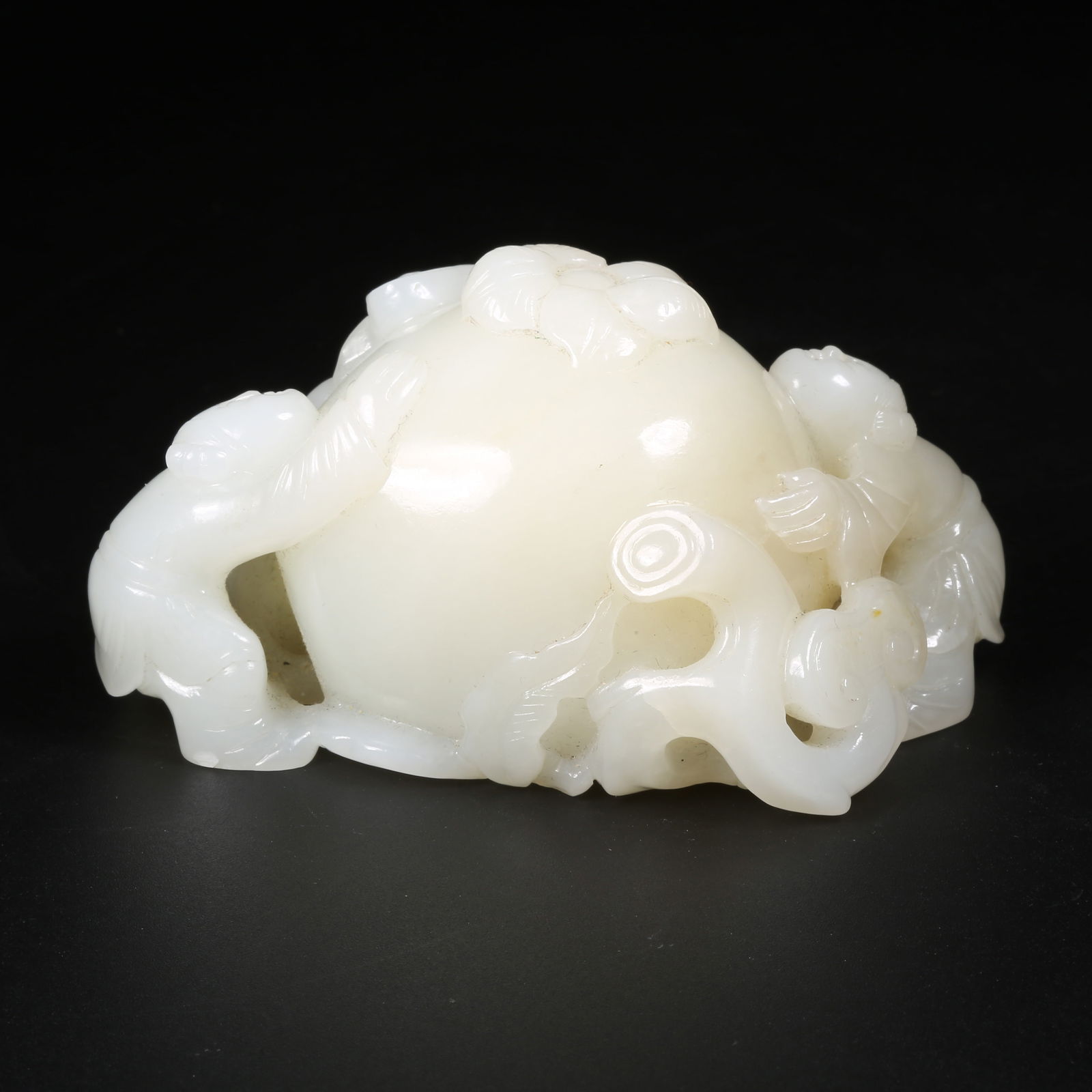 A HETIAN JADE LINGZHI CHILD ORNAMENT (1 of 8)