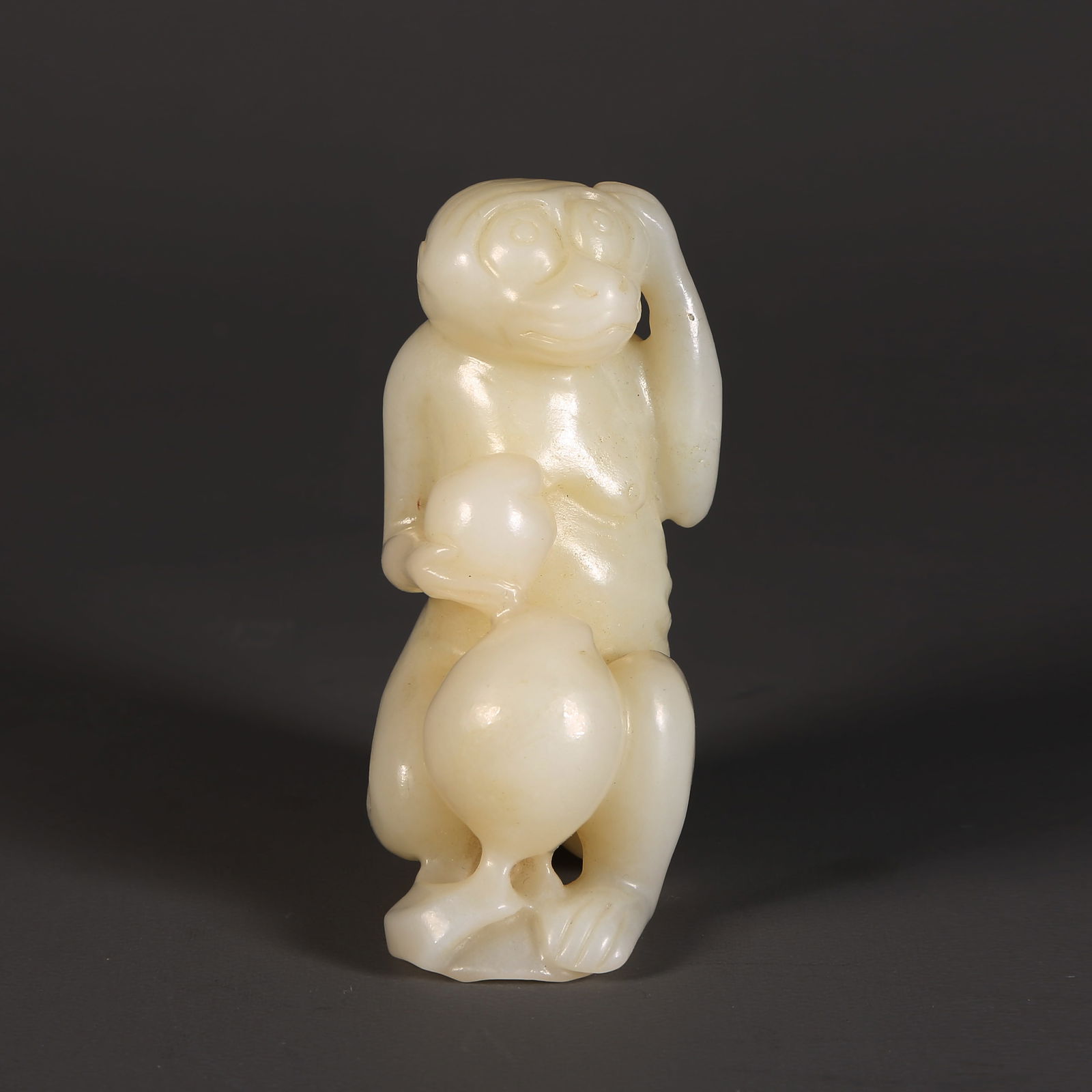 A HETIAN JADE AUSPICIOUS MONKEY OFFERING LONGEVITY ORNAMENT (1 of 8)