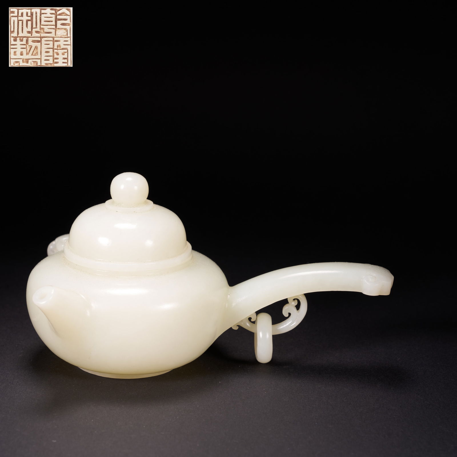 A HETIAN WHITE JADE LONG-HANDLED EWER WITH RUYI-SHAPED HANDLES AND MOVABLE RINGS, QING DYNASTY (1 of 8)