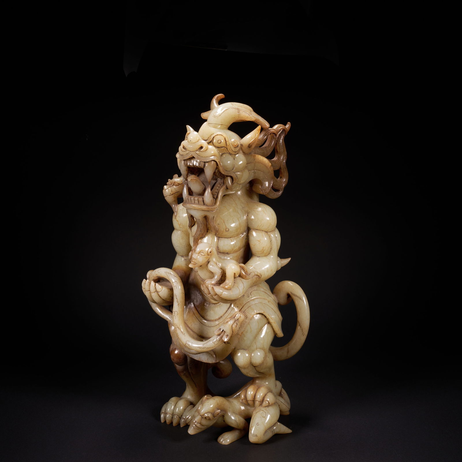 A HETIAN JADE "DRAGON KING" MYTHICAL BEAST ORNAMENT, HAN DYNASTY (1 of 10)