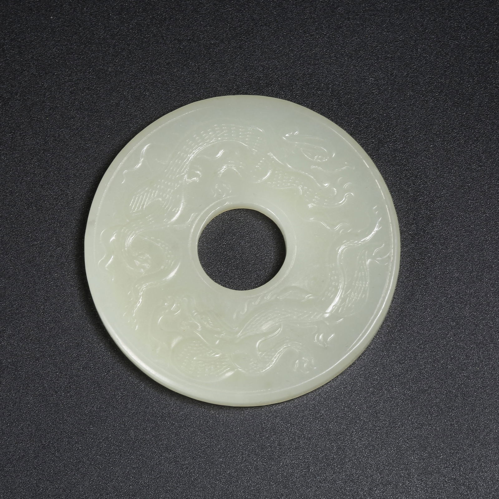 A HETIAN JADE RING WITH CHI-DRAGON PATTERN (1 of 9)