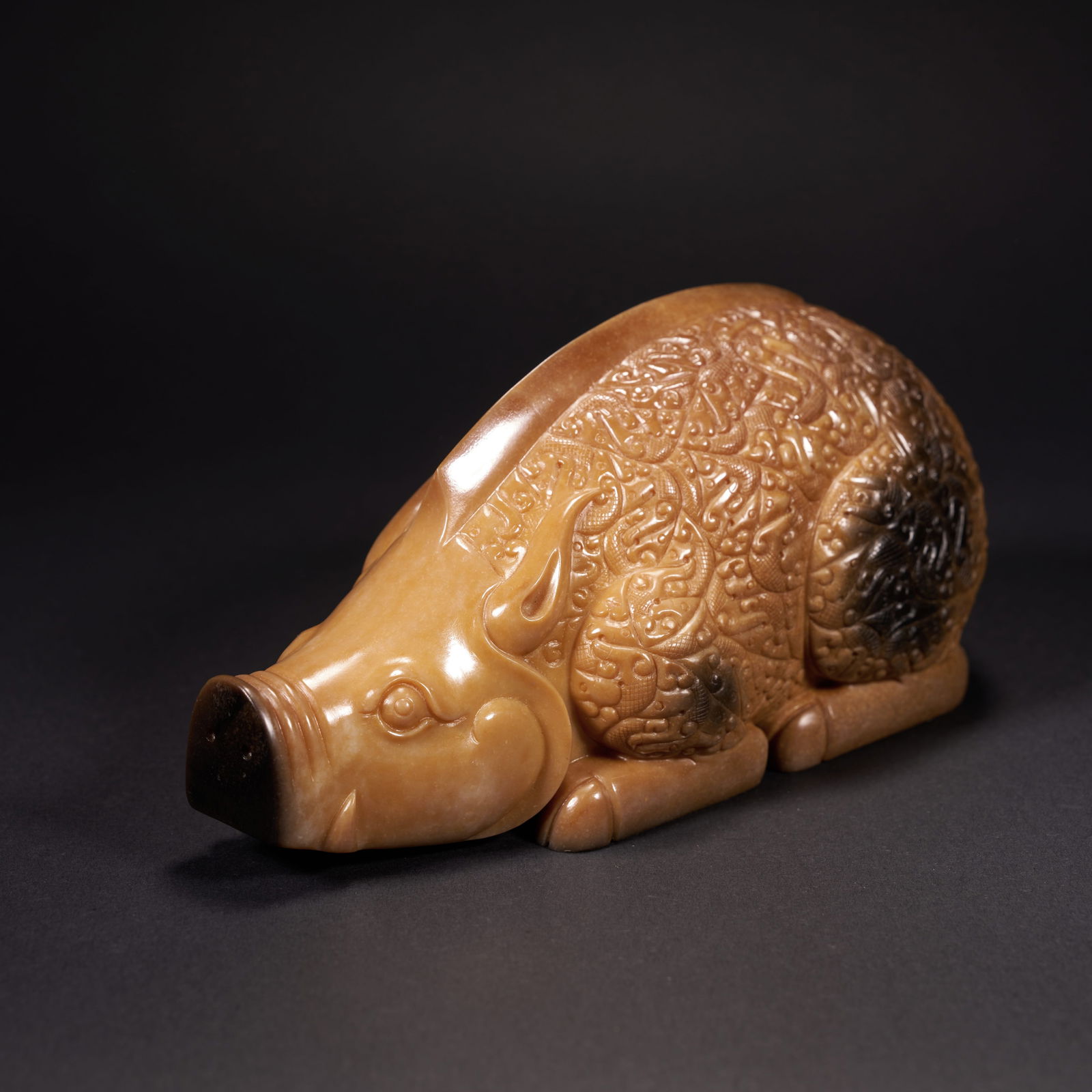 A HETIAN JADE WILD BOAR ORNAMENT, HAN DYNASTY (1 of 9)