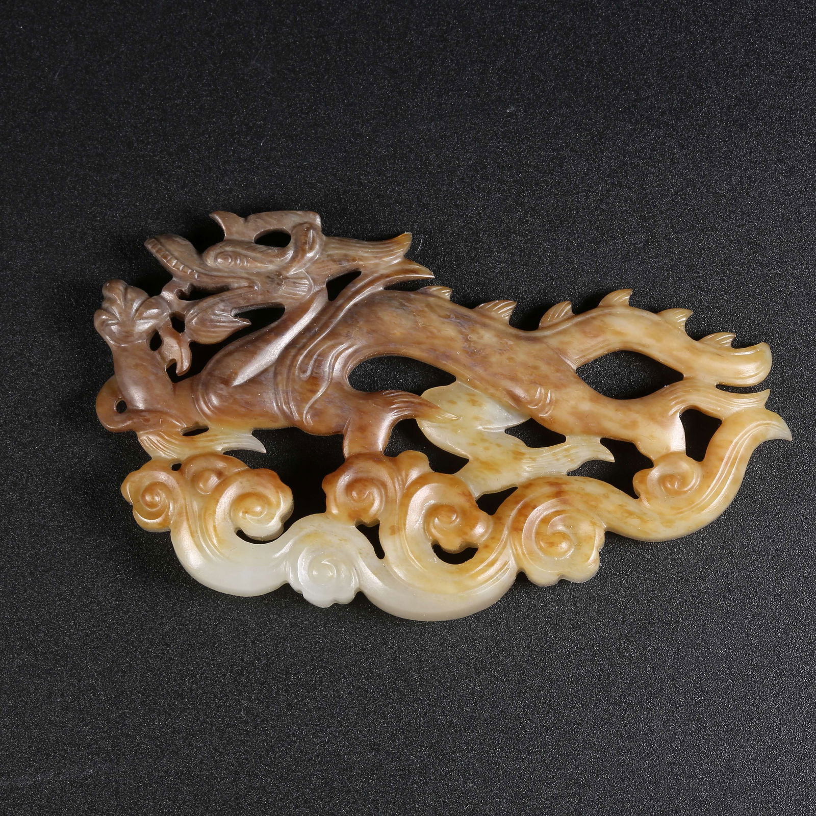 A HETIAN JADE CHI-DRAGON AND AUSPICIOUS CLOUD PENDANT: Hetian jade chi-dragon and auspicious cloud pendant