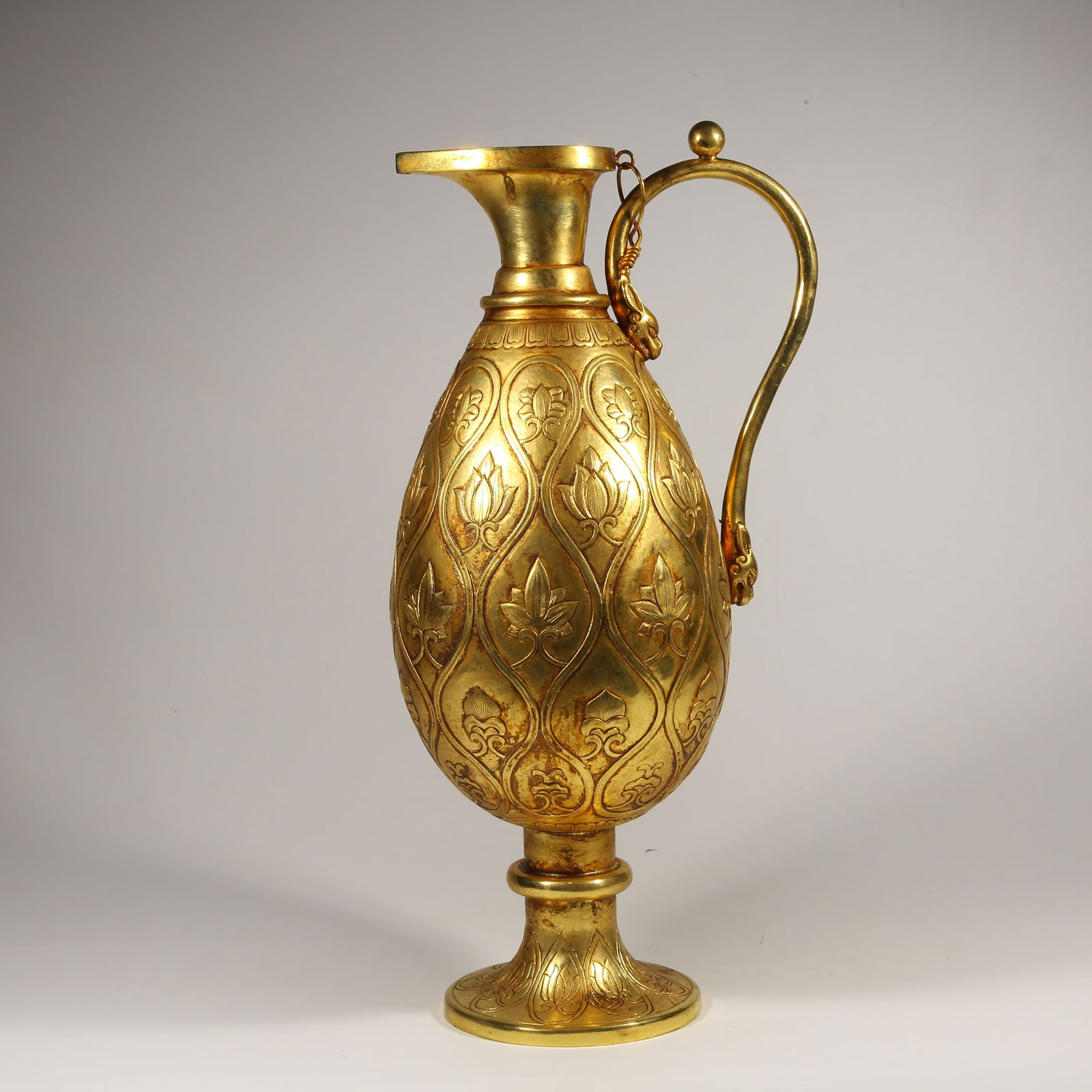 A GILDED BRONZE PERSIAN POT WITH FLORAL PATTERN (1 of 9)
