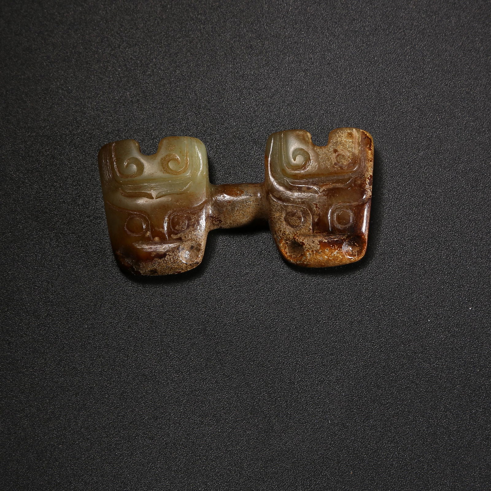 A ARCHAIC JADE PENDANT WITH DIVINE-HUMAN FACE (1 of 9)