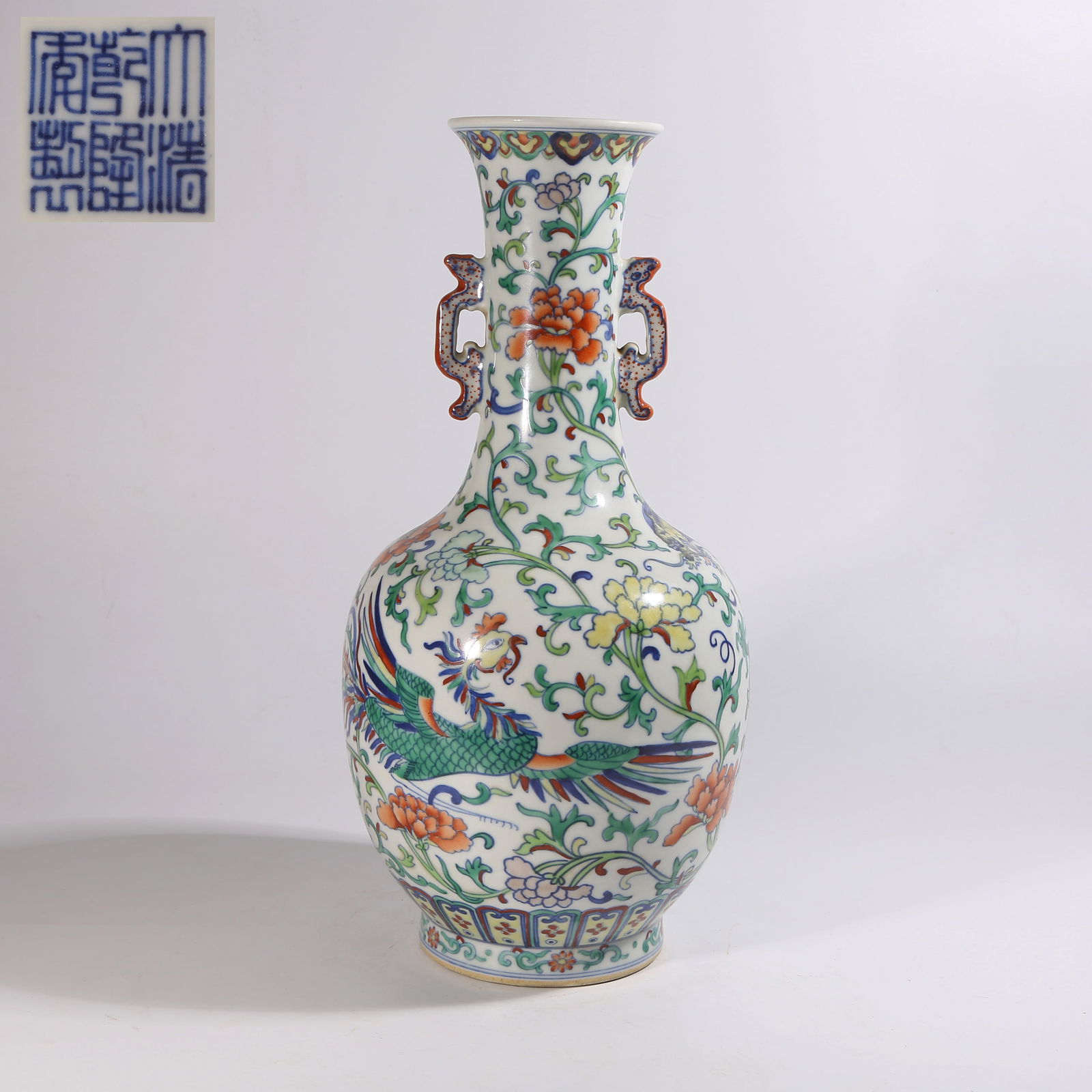 A DOUCAI DOUBLE-HANDLED VASE WITH "DRAGON AND PHOENIX AMID FLOWERS" DESIGN: Doucai Double-Handled Vase with "Dragon and Phoenix Amid Flowers" Design