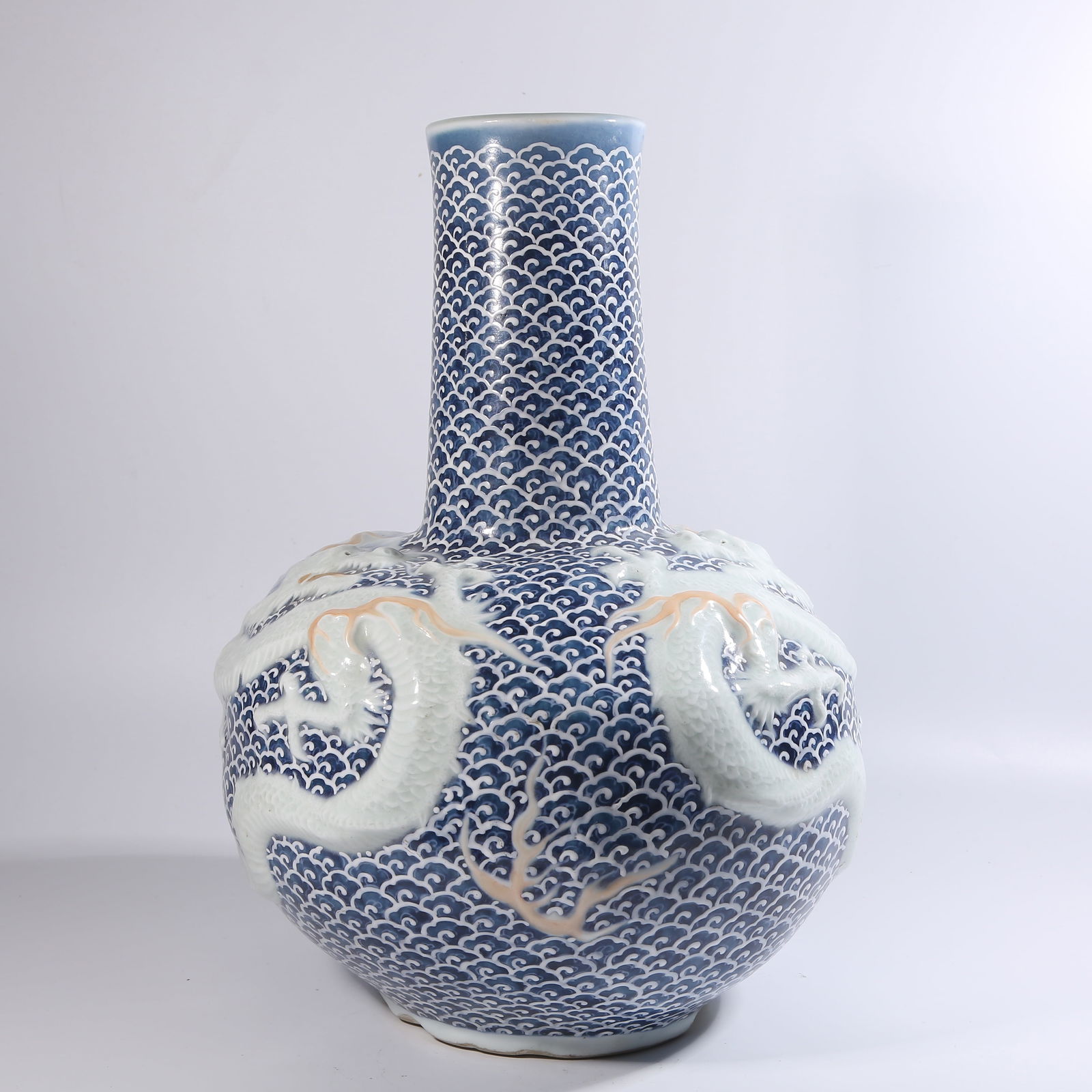 A BLUE-AND-WHITE TIANQIU VASE WITH RESERVED RELIEF DRAGON PATTERN (1 of 11)