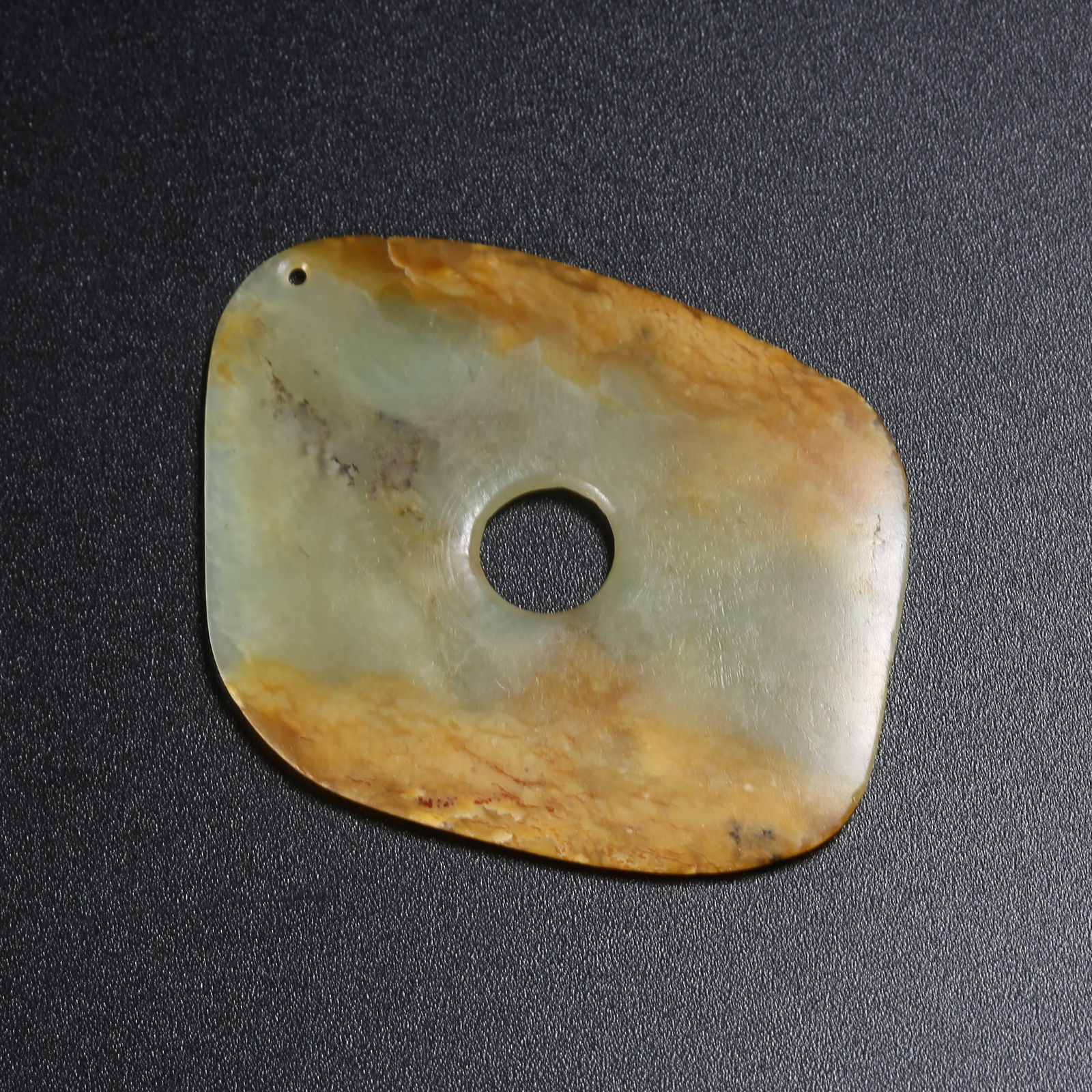 A ARCHAIC JADE RING-SHAPED OBJECT (1 of 10)