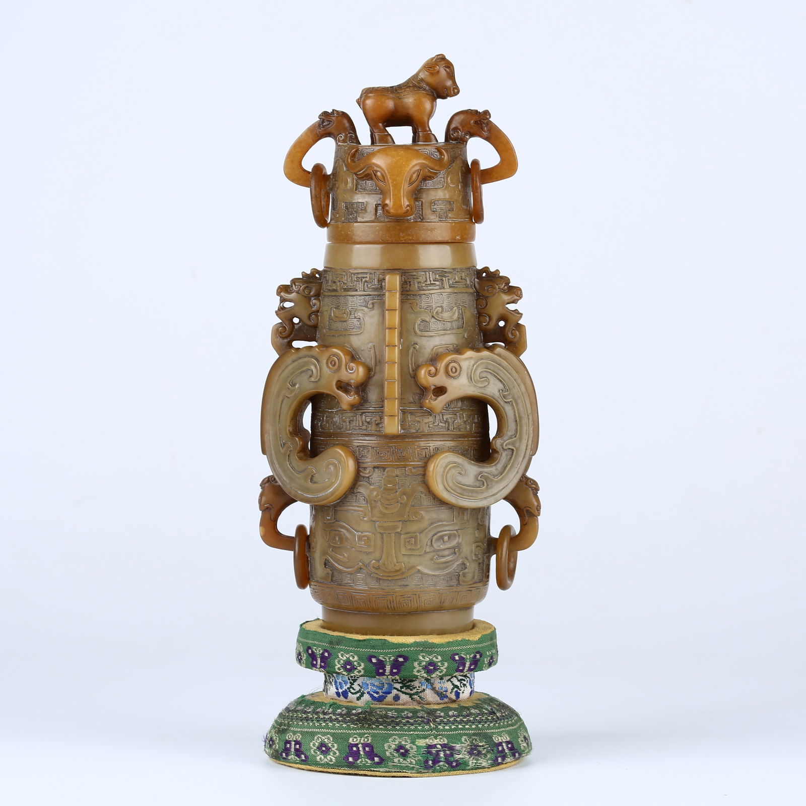 A SHOUSHAN STONE CARVED BEAST FACE PATTERN COVERED BOTTLE: Shoushan Stone Carved Beast Face Pattern Covered Bottle