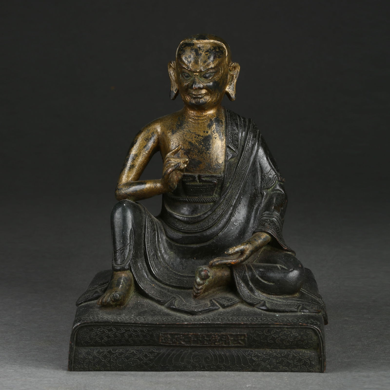 A GILDED BRONZE ARHAT STATUE (1 of 9)