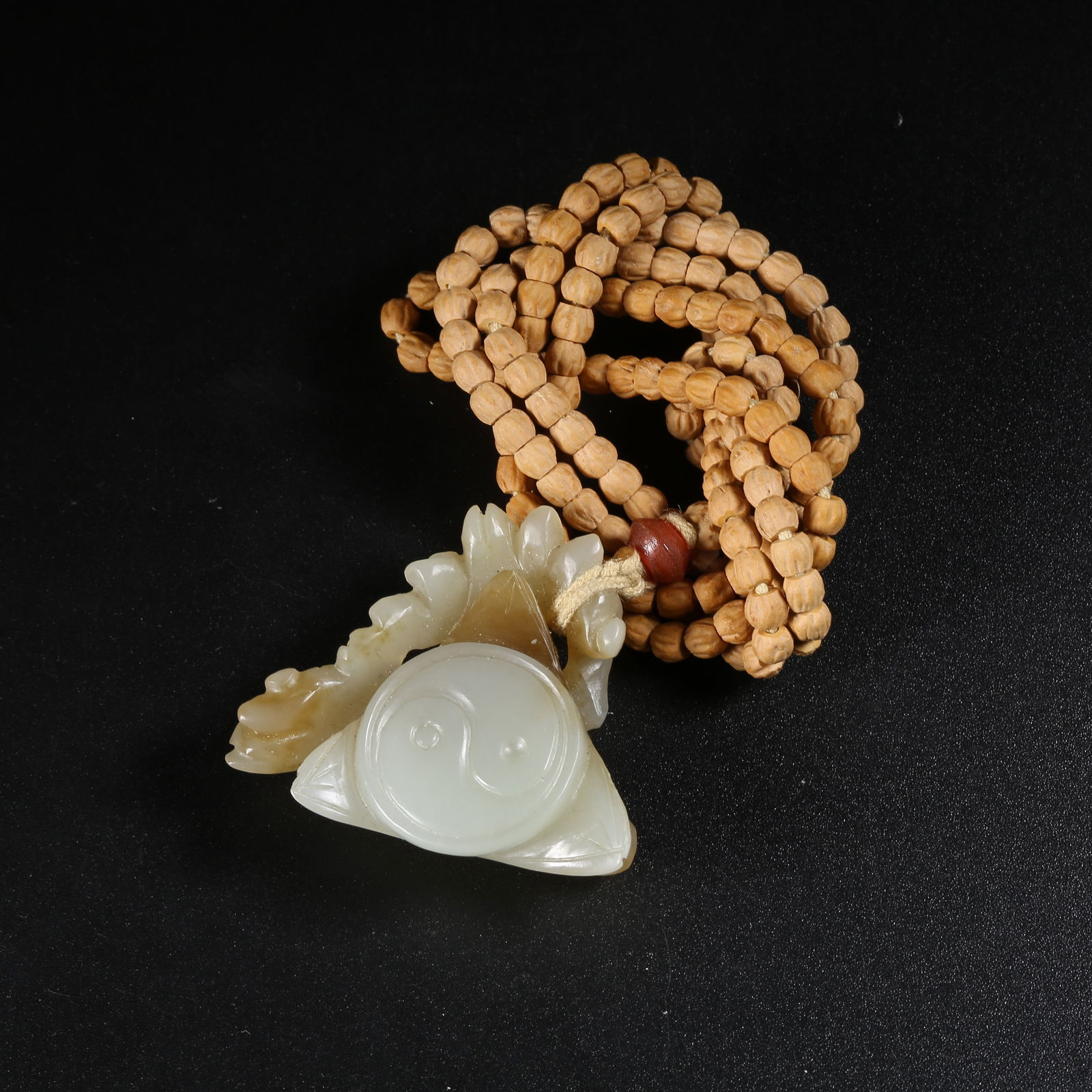 A HETIAN JADE YIN-YANG FISH PENDANT (1 of 9)