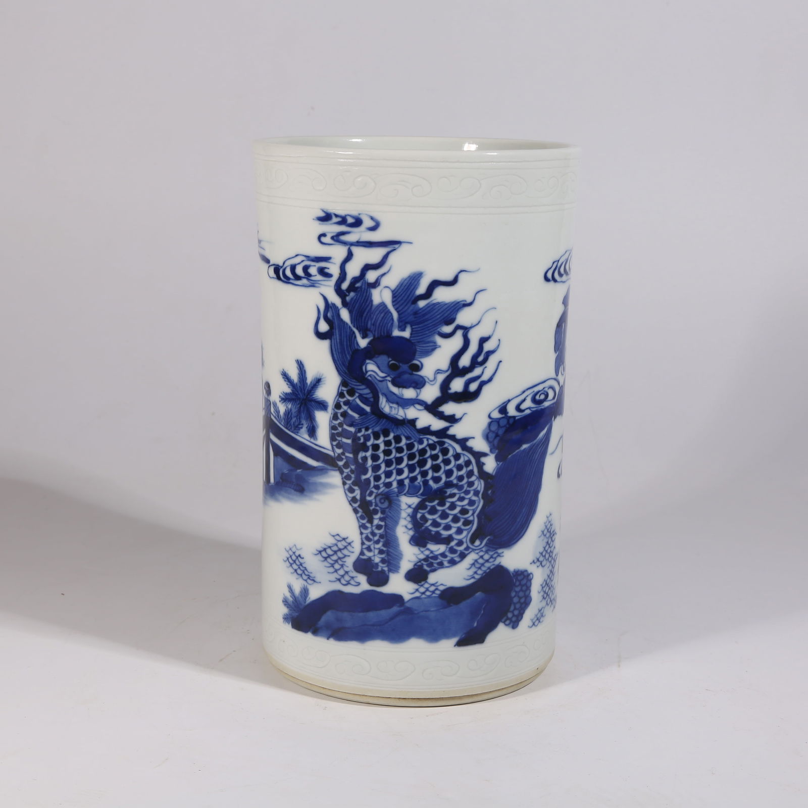 A BLUE-AND-WHITE BRUSH HOLDER WITH QILIN DESIGN (1 of 9)