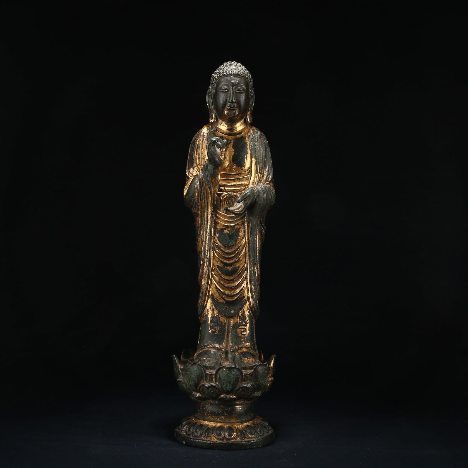 A GILT BRONZE STANDING STATUE OF SHAKYAMUNI (1 of 9)