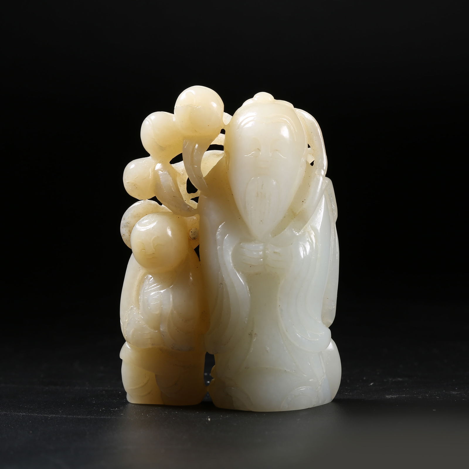 A HETIAN JADE FIGURINE OF LONGEVITY-OFFERING CHILD (1 of 8)