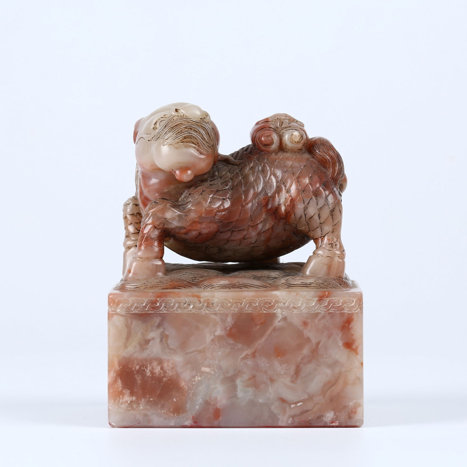 A SHOUSHAN STONE CARVED AUSPICIOUS BEAST KNOB SEAL: Shoushan Stone Carved Auspicious Beast Knob Seal