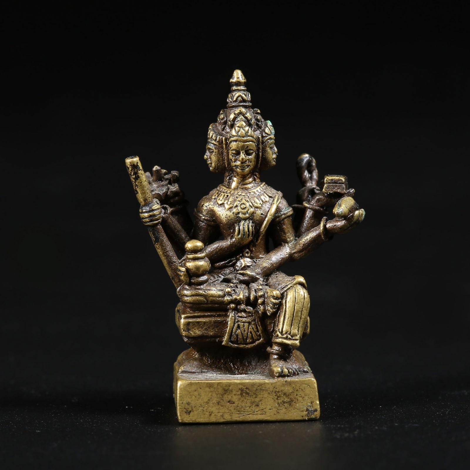 A GILT-BRONZE MINIATURE BUDDHA (1 of 8)
