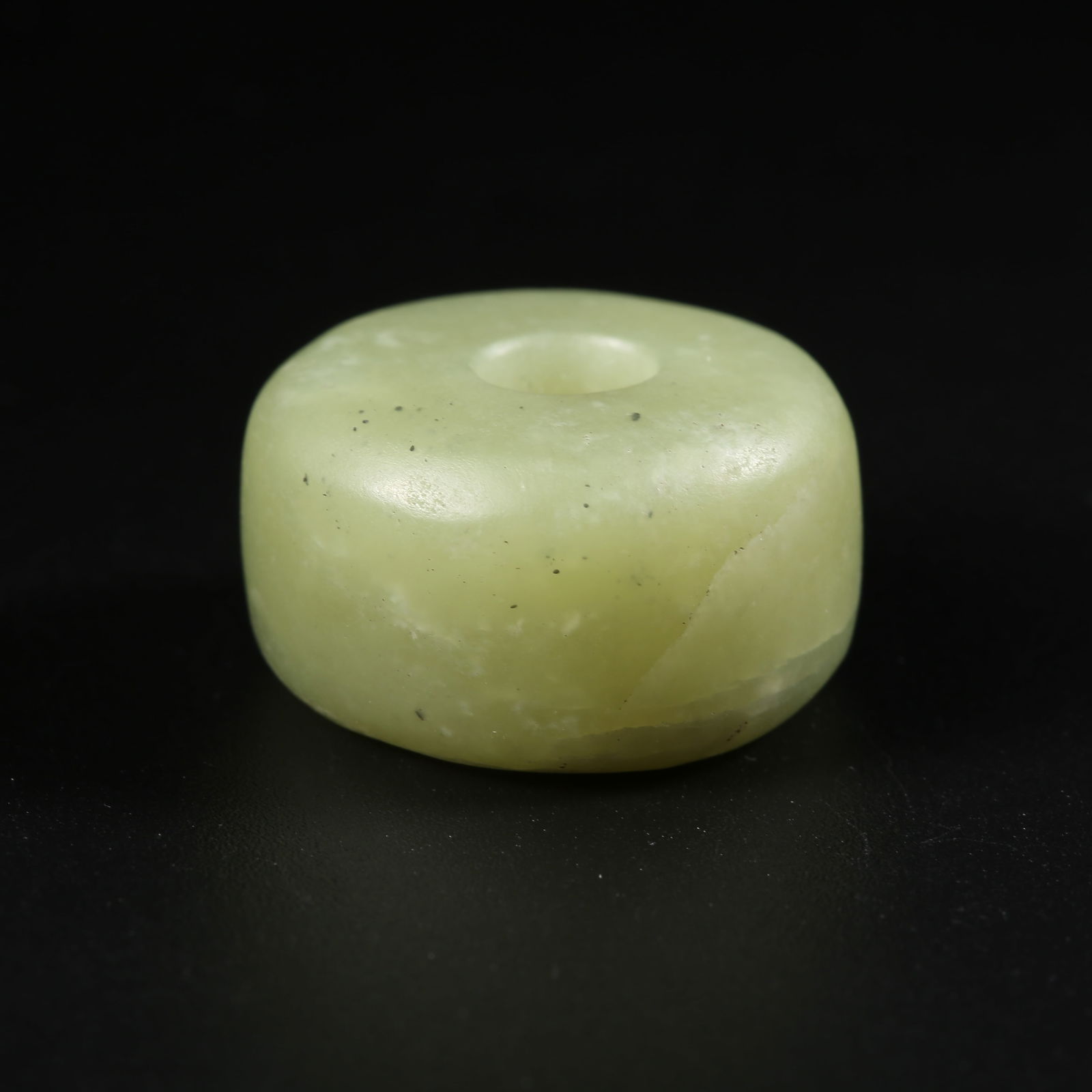 A ARCHAIC JADE BUTTON (1 of 9)