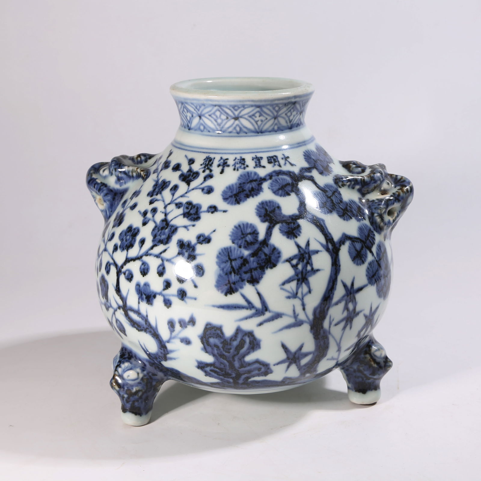A BLUE-AND-WHITE THREE-LEGGED CENSER WITH "THREE FRIENDS OF WINTER" MOTIF AND BEAST HANDLES (1 of 9)
