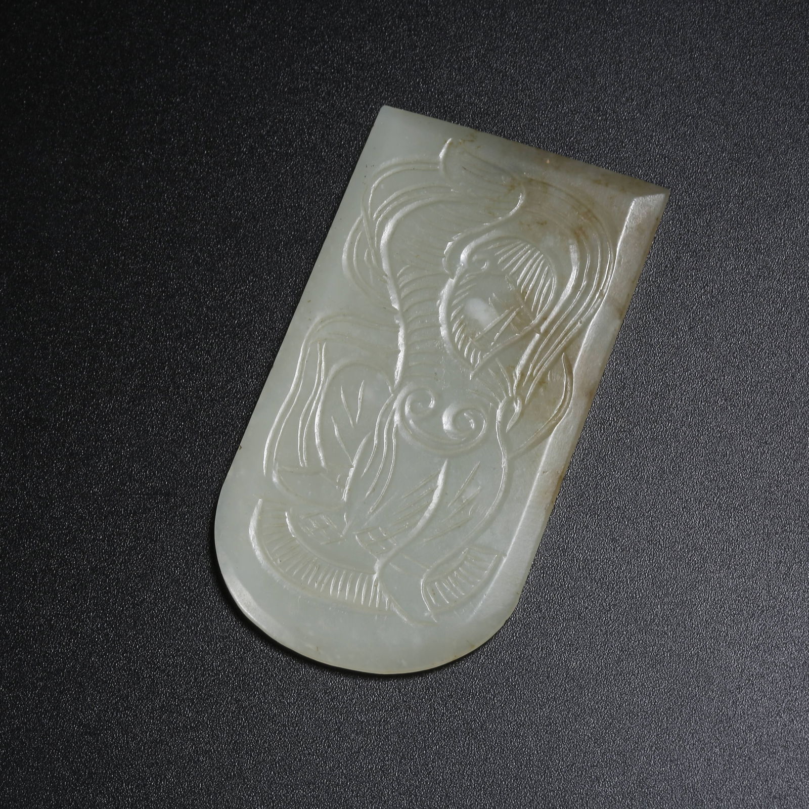 A HETIAN JADE HU (CENTRAL ASIAN) FIGURE WITH TAMED LION BELT PLAQUE: Hetian Jade Hu (Central Asian) Figure with Tamed Lion Belt Plaque