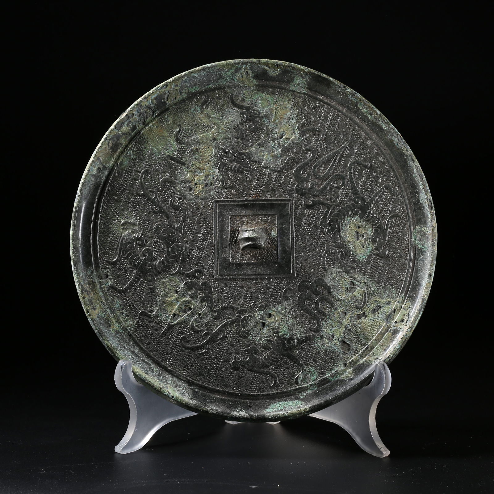 A BRONZE MIRROR WITH CHI-DRAGON PATTERN: Bronze Mirror with Chi-Dragon Pattern