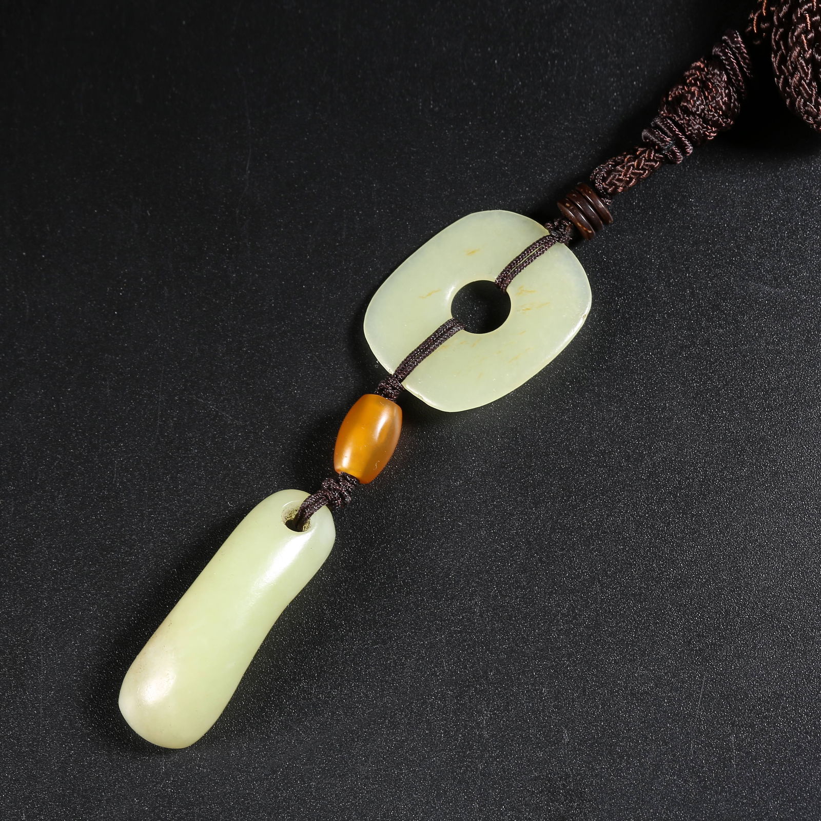 A SET OF ARCHAIC JADE PENDANTS (1 of 7)